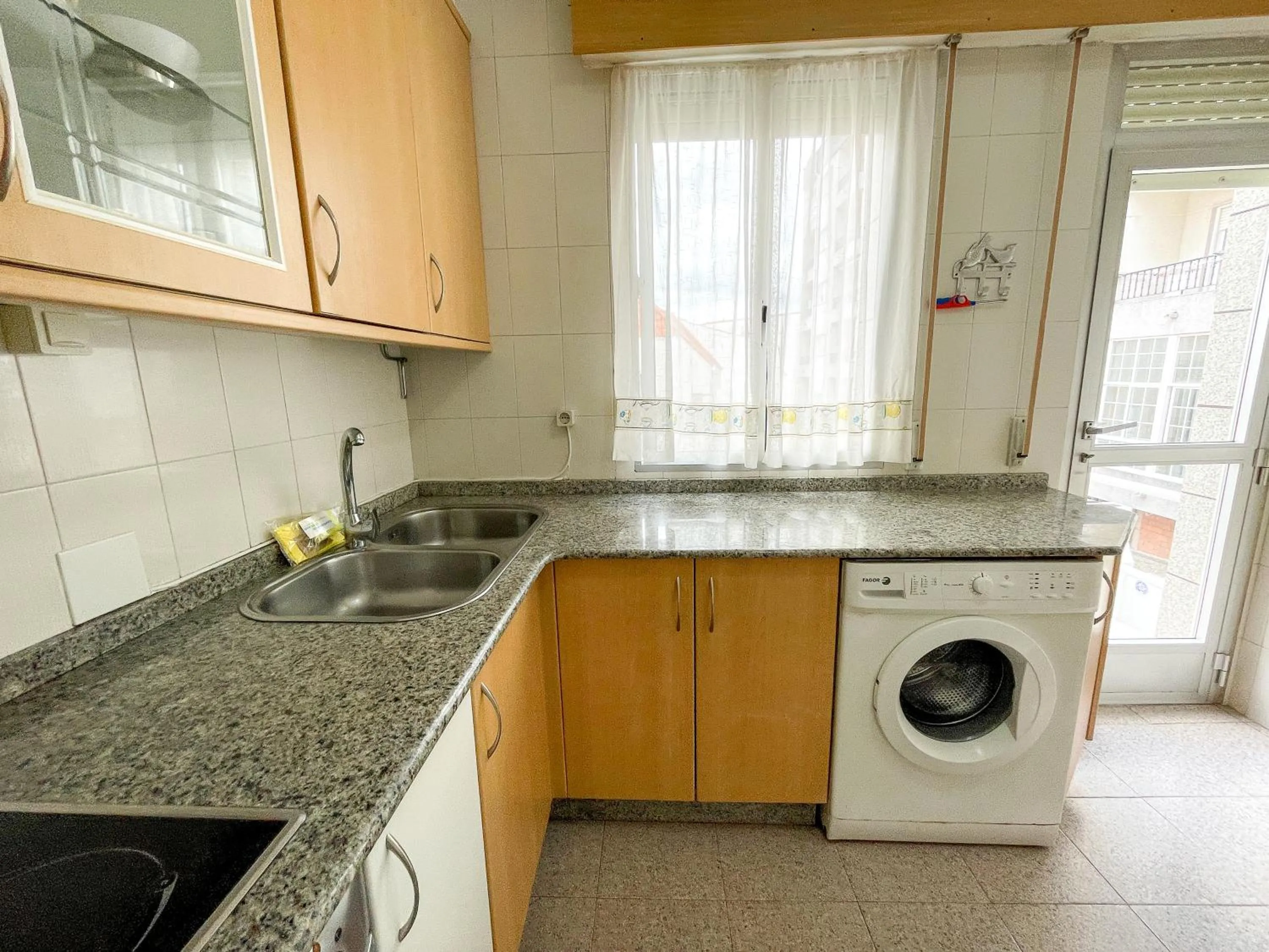 Kitchen or kitchenette in Apartamentos Portonovo 3000