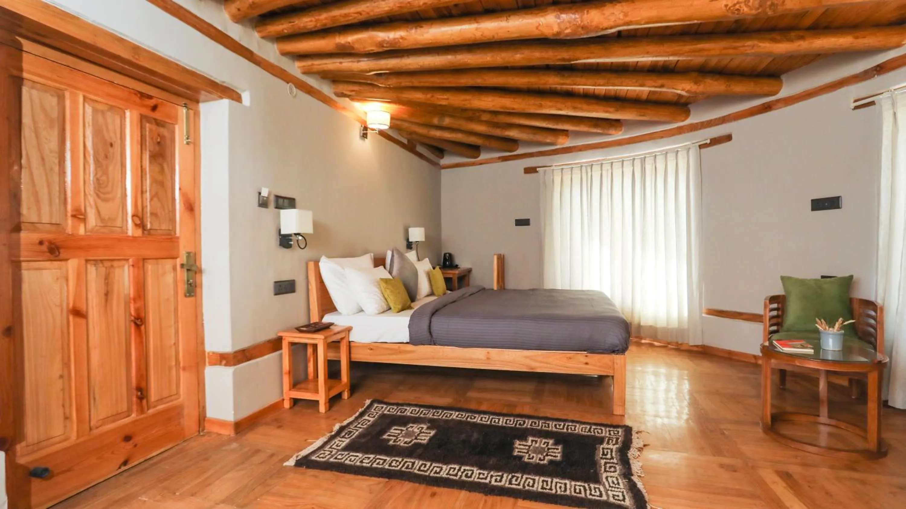Seating area, Bed in Dakpa House Ladakh