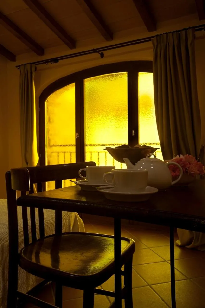 Seating area, Bed in Agriturismo Le Case