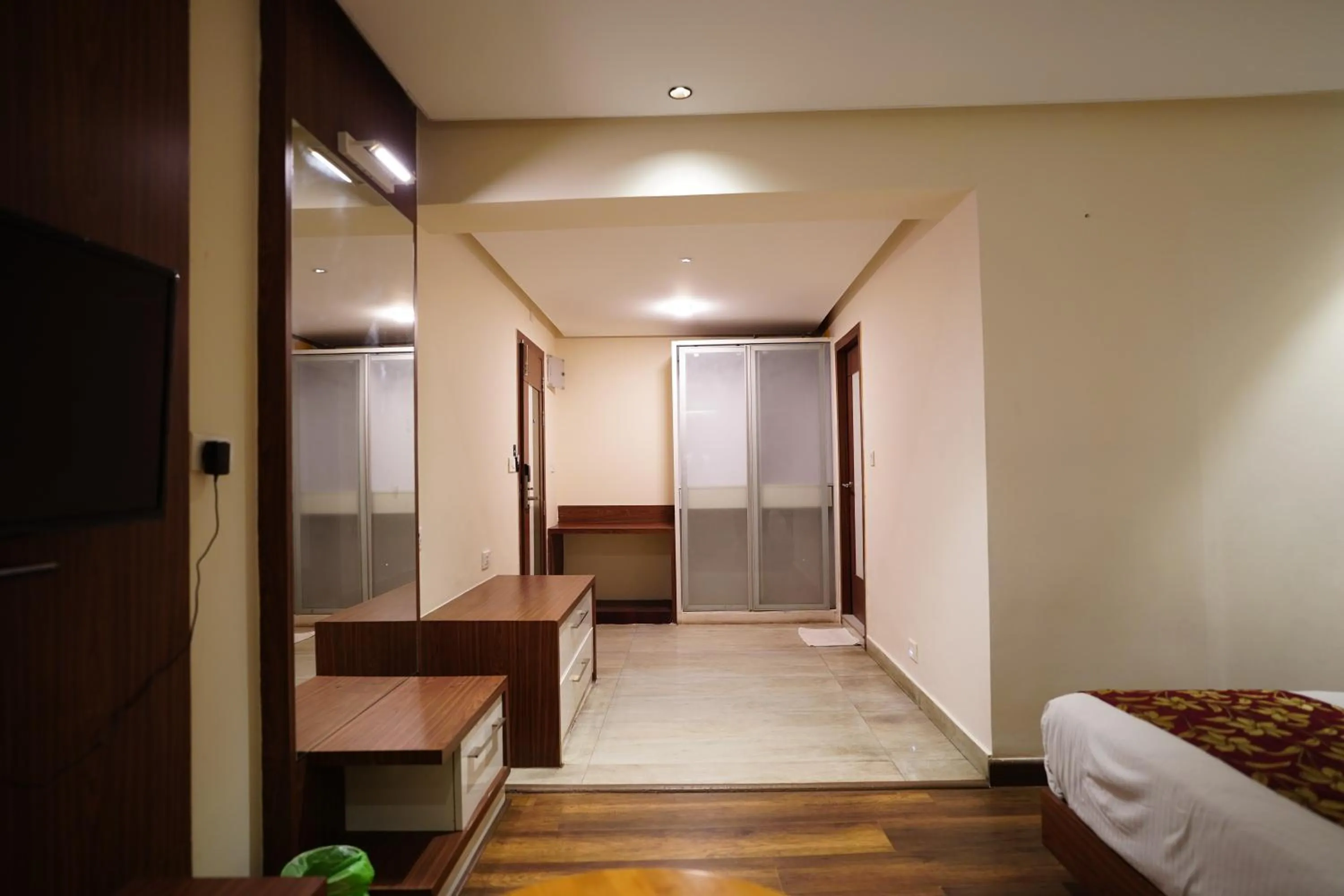 Photo of the whole room, Bed in Emarald Hotel Calicut