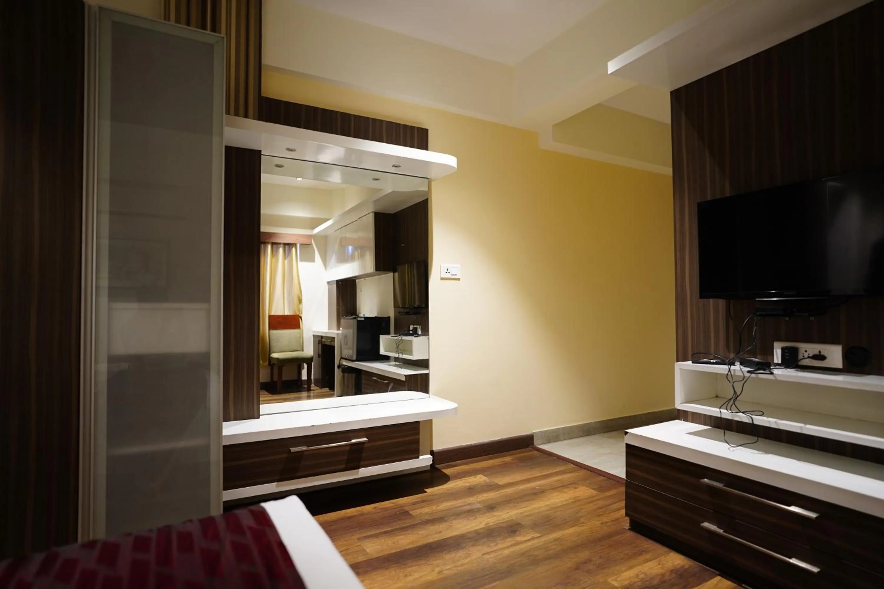 Bed in Emarald Hotel Calicut