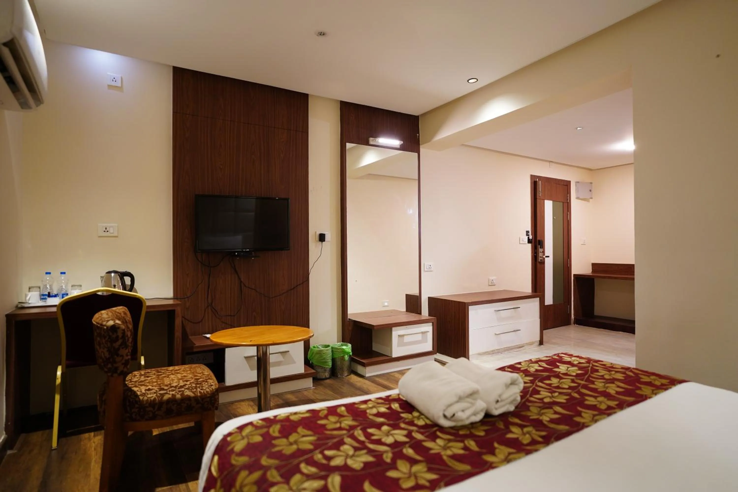Bed in Emarald Hotel Calicut