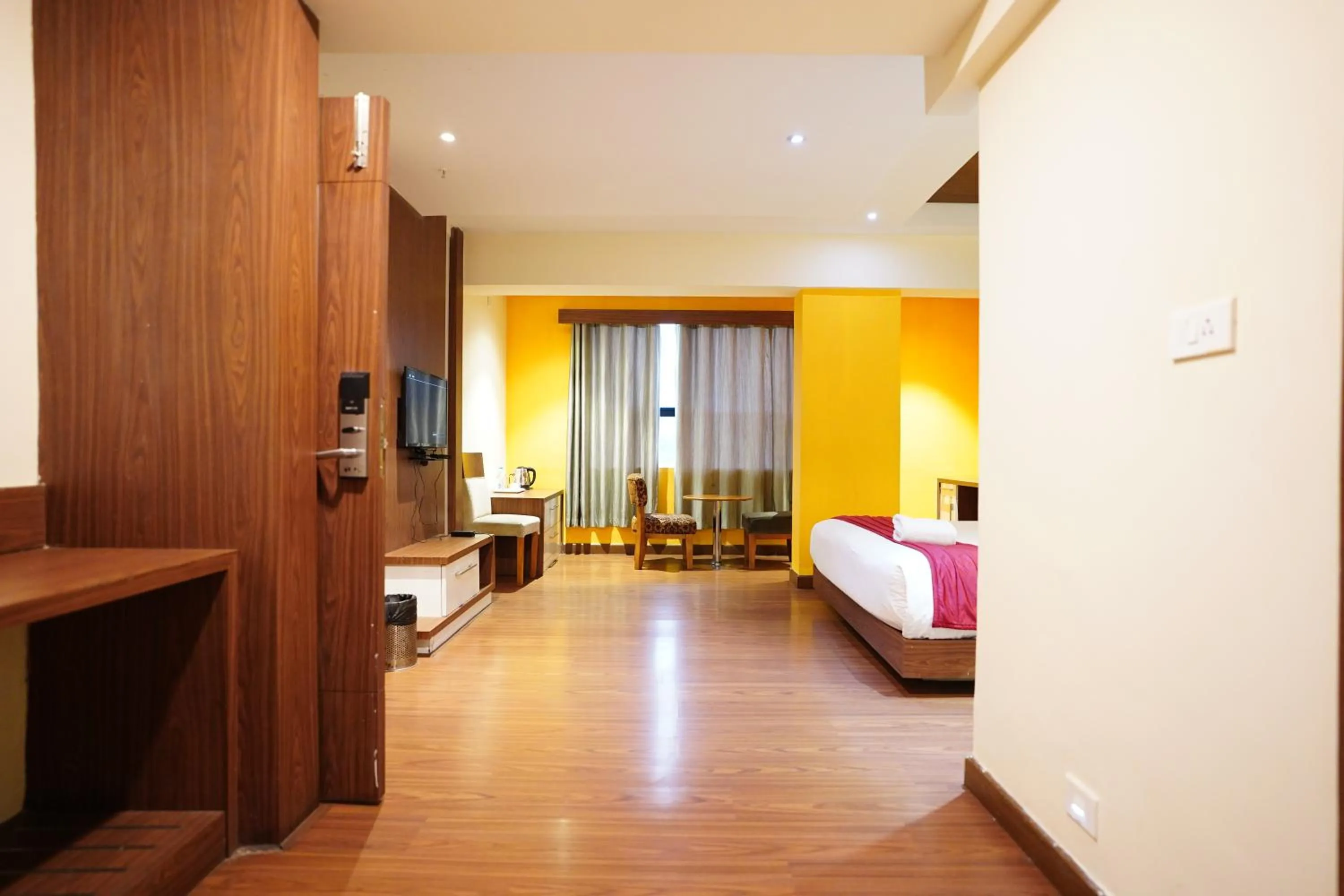 Bed in Emarald Hotel Calicut