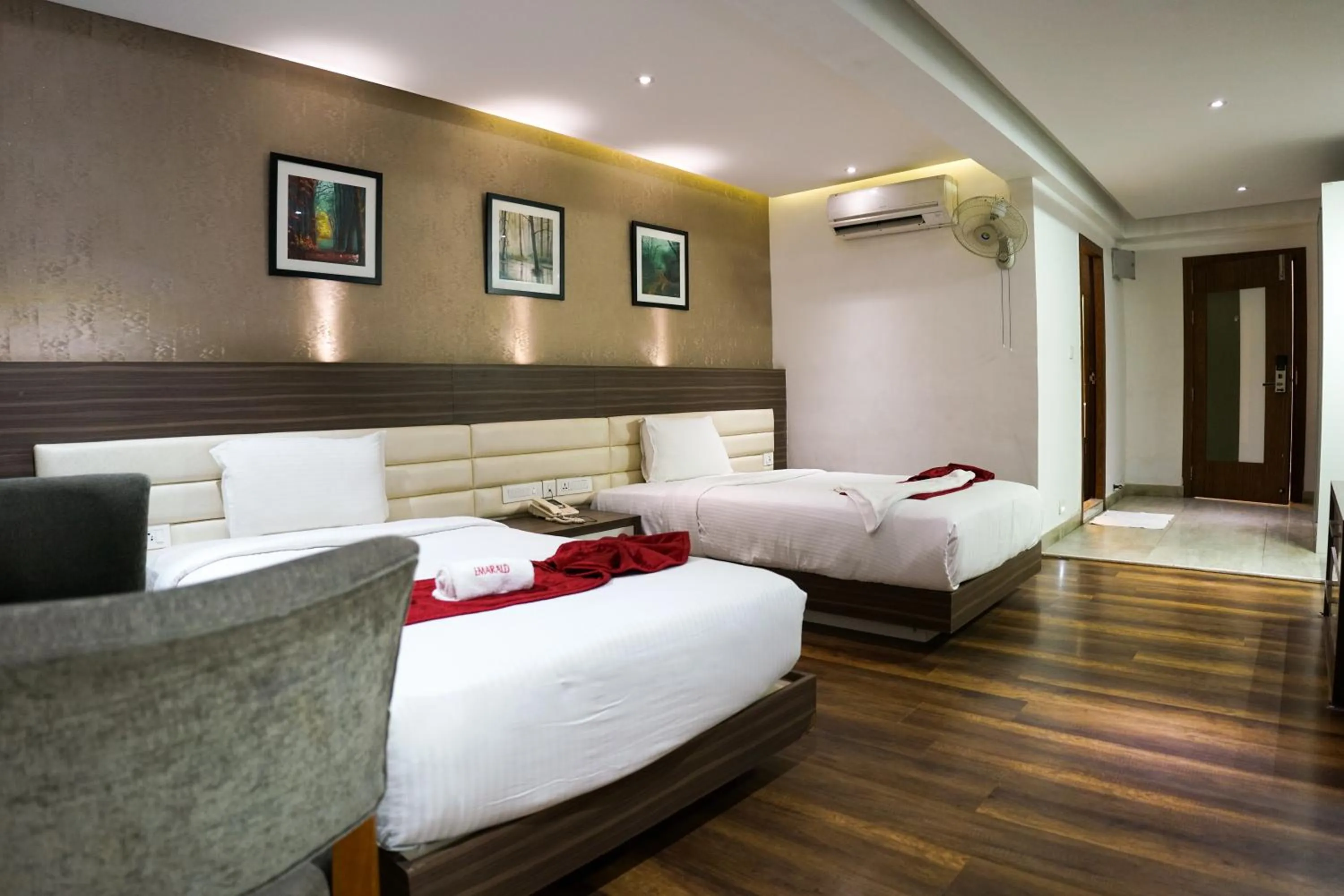 Bed in Emarald Hotel Calicut