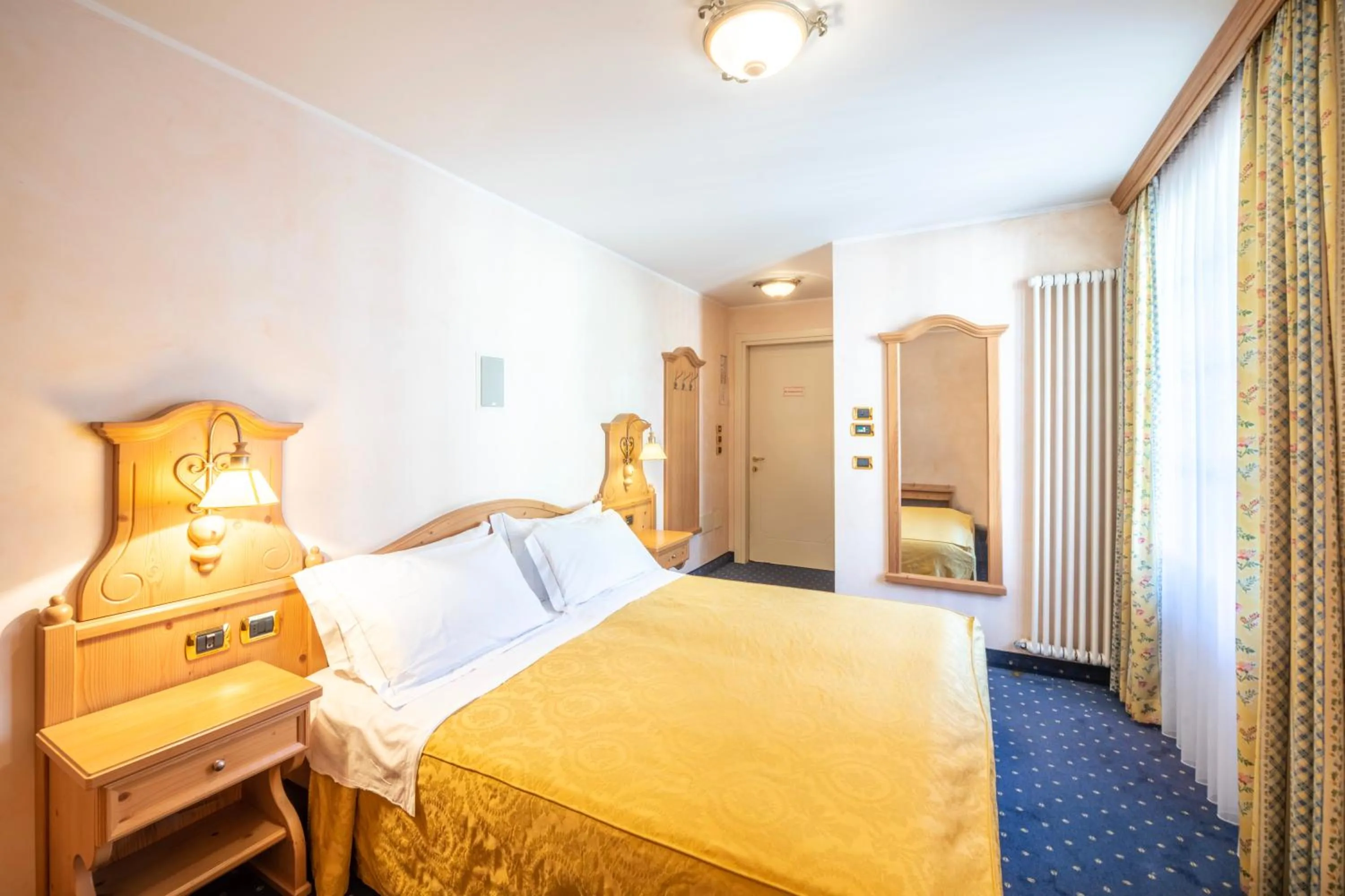 Bed in Hotel Relais Orsingher