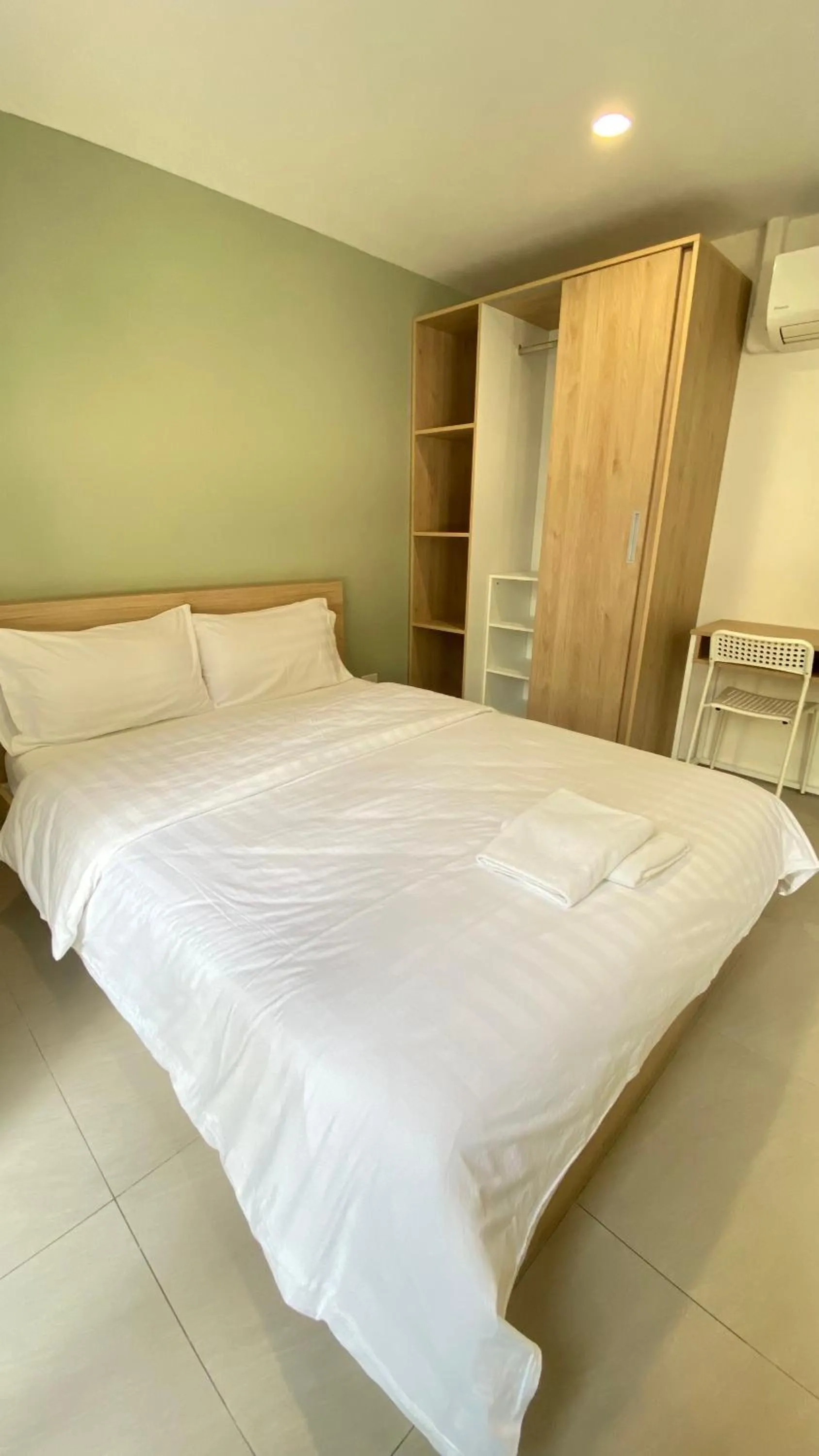 Bed in POP Heritage Residence