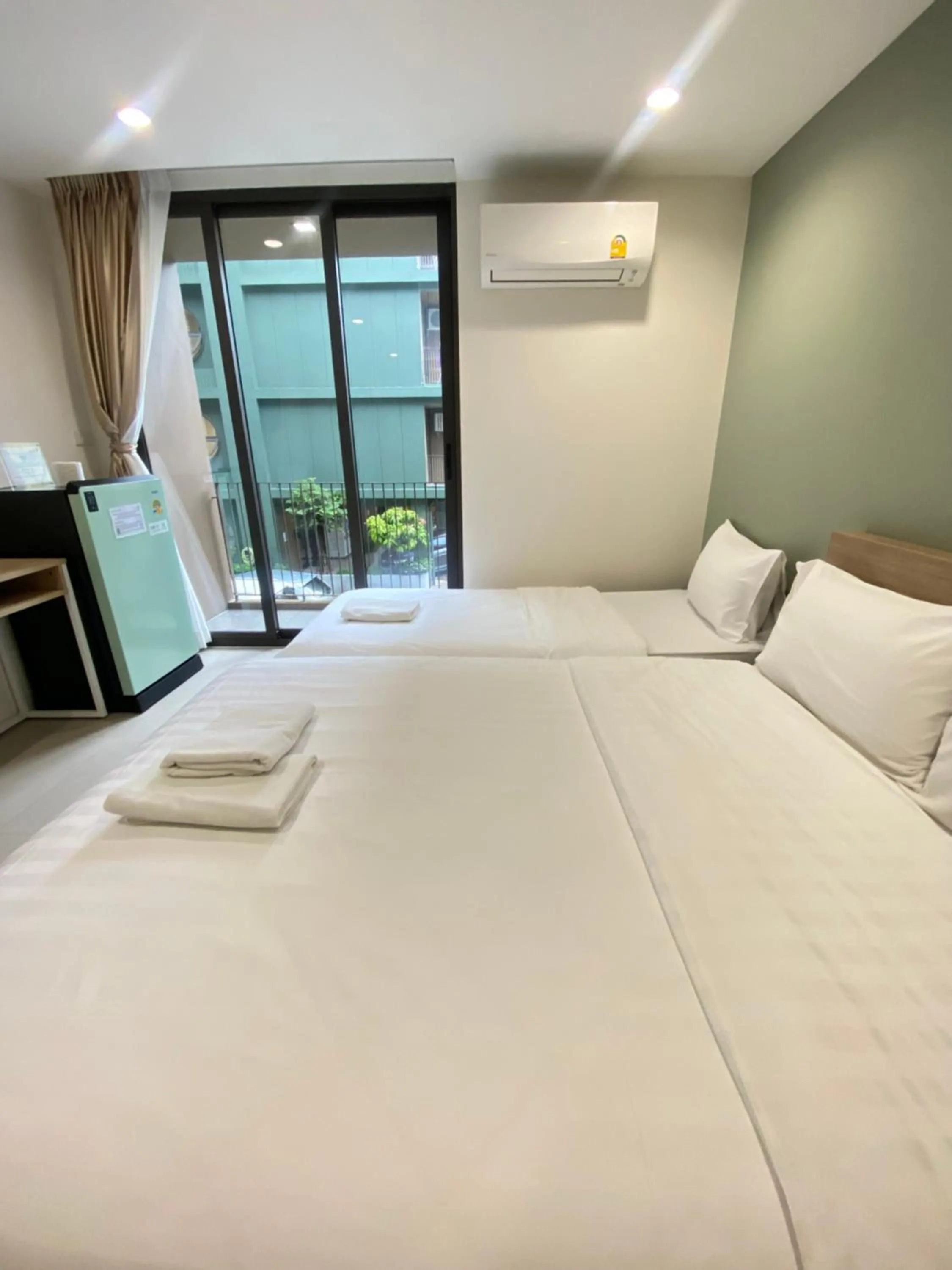 Bed in POP Heritage Residence