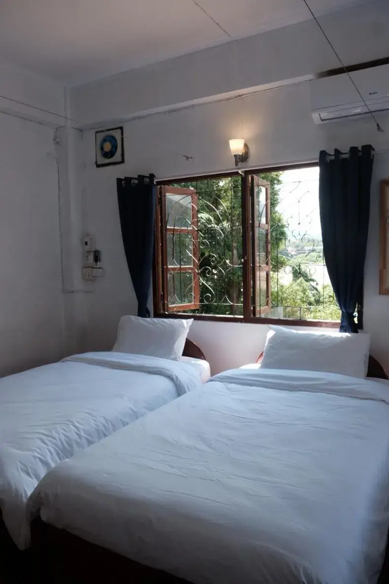 Bed in Sabaydee Guesthouse Bed in Sabaydee Guesthouse