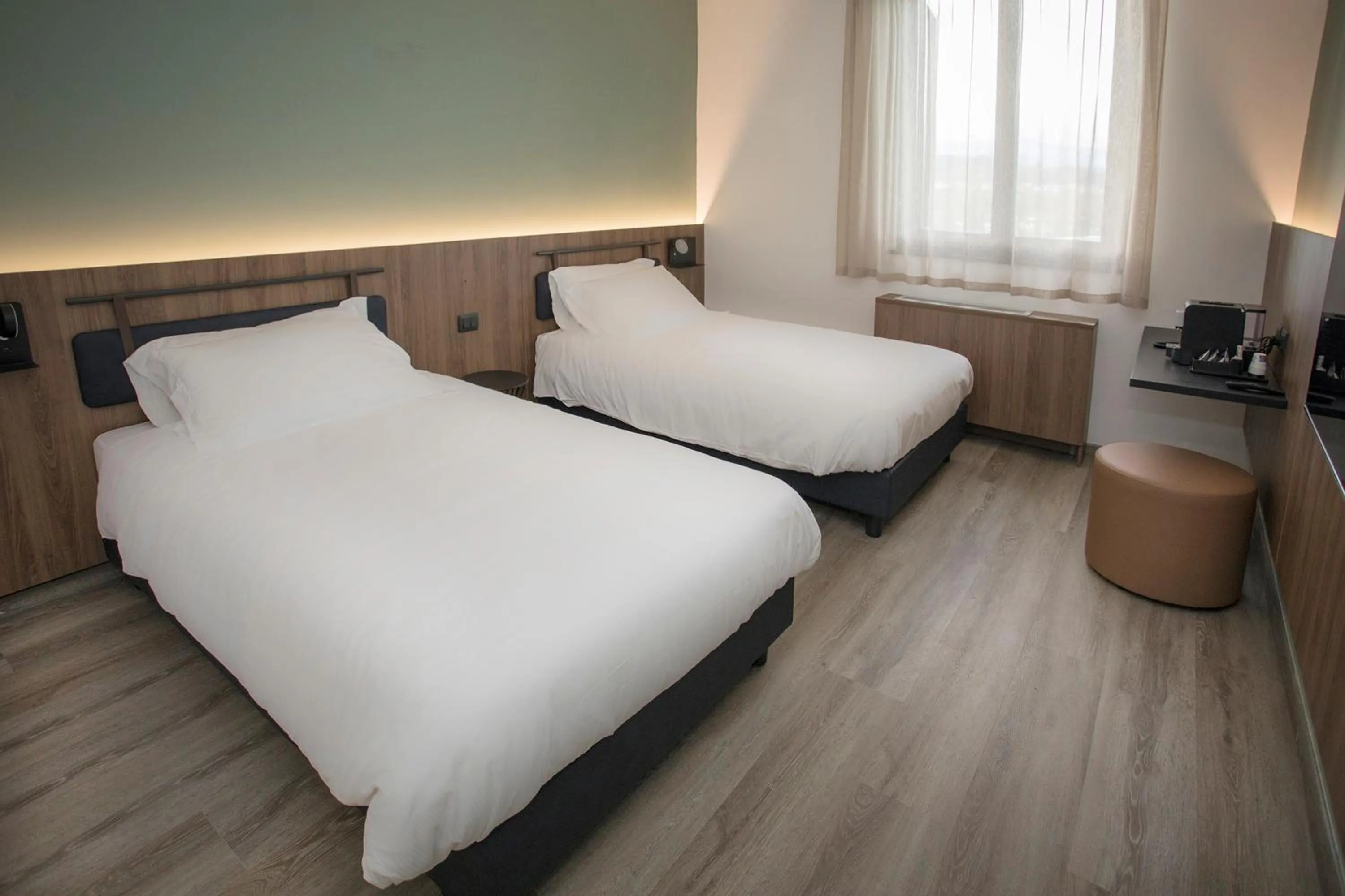 Bed in Moody smart & comfy Hotel