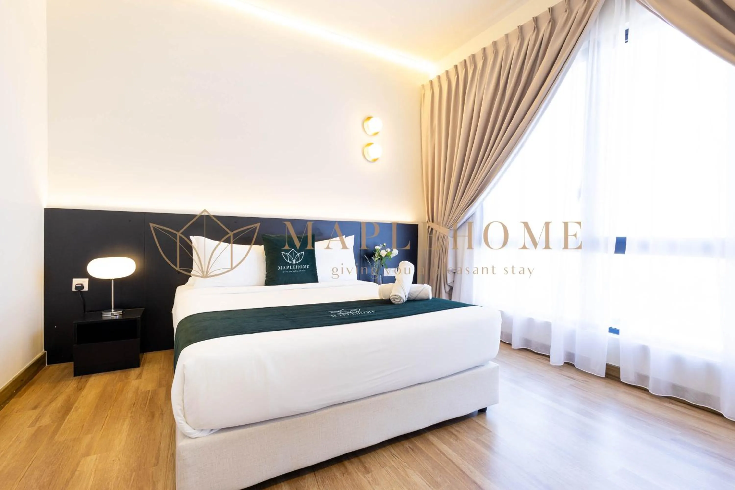 Bed in The Apple Premier Suites Melaka