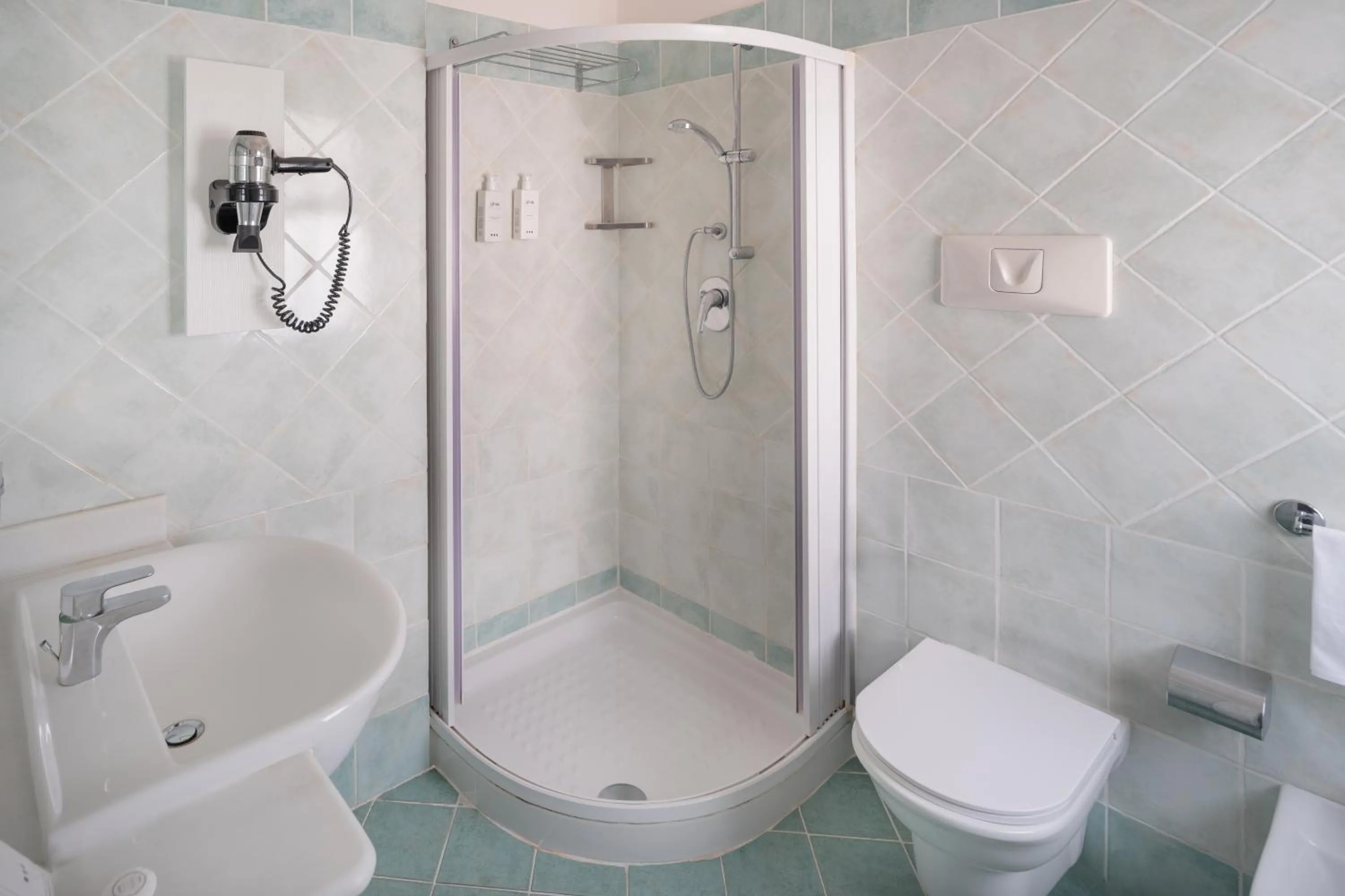 Bathroom in UNA Hotels Naxos Beach Sicilia