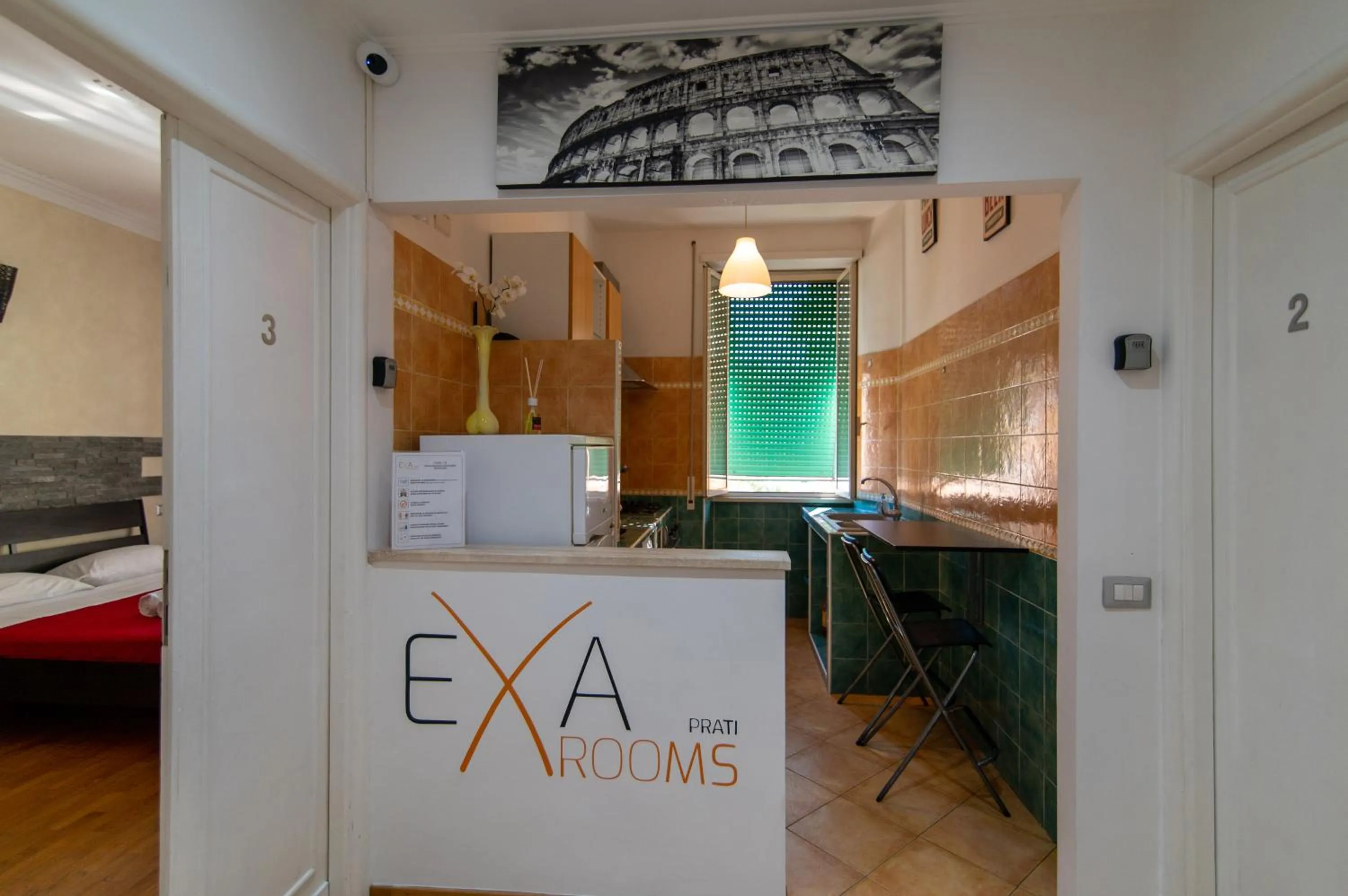 Communal kitchen in Exa Rooms - Prati