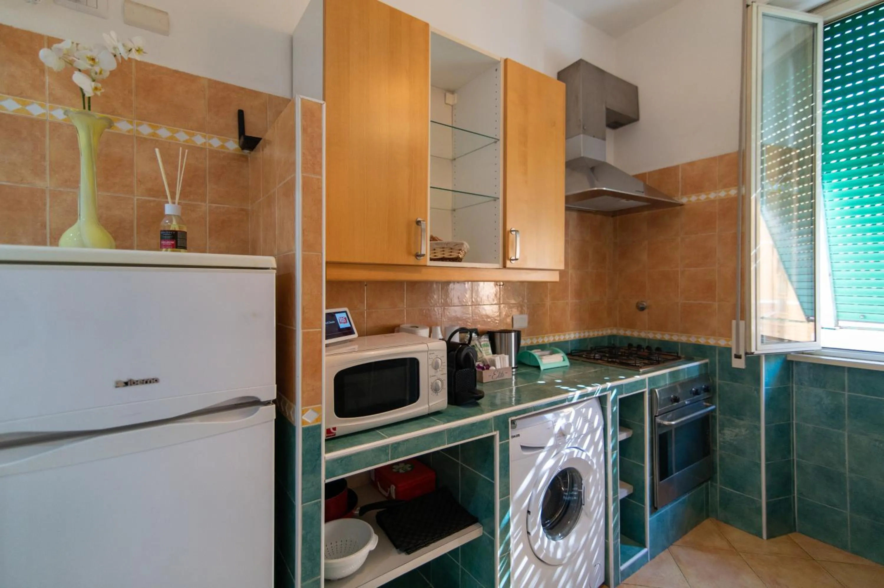 Communal kitchen in Exa Rooms - Prati