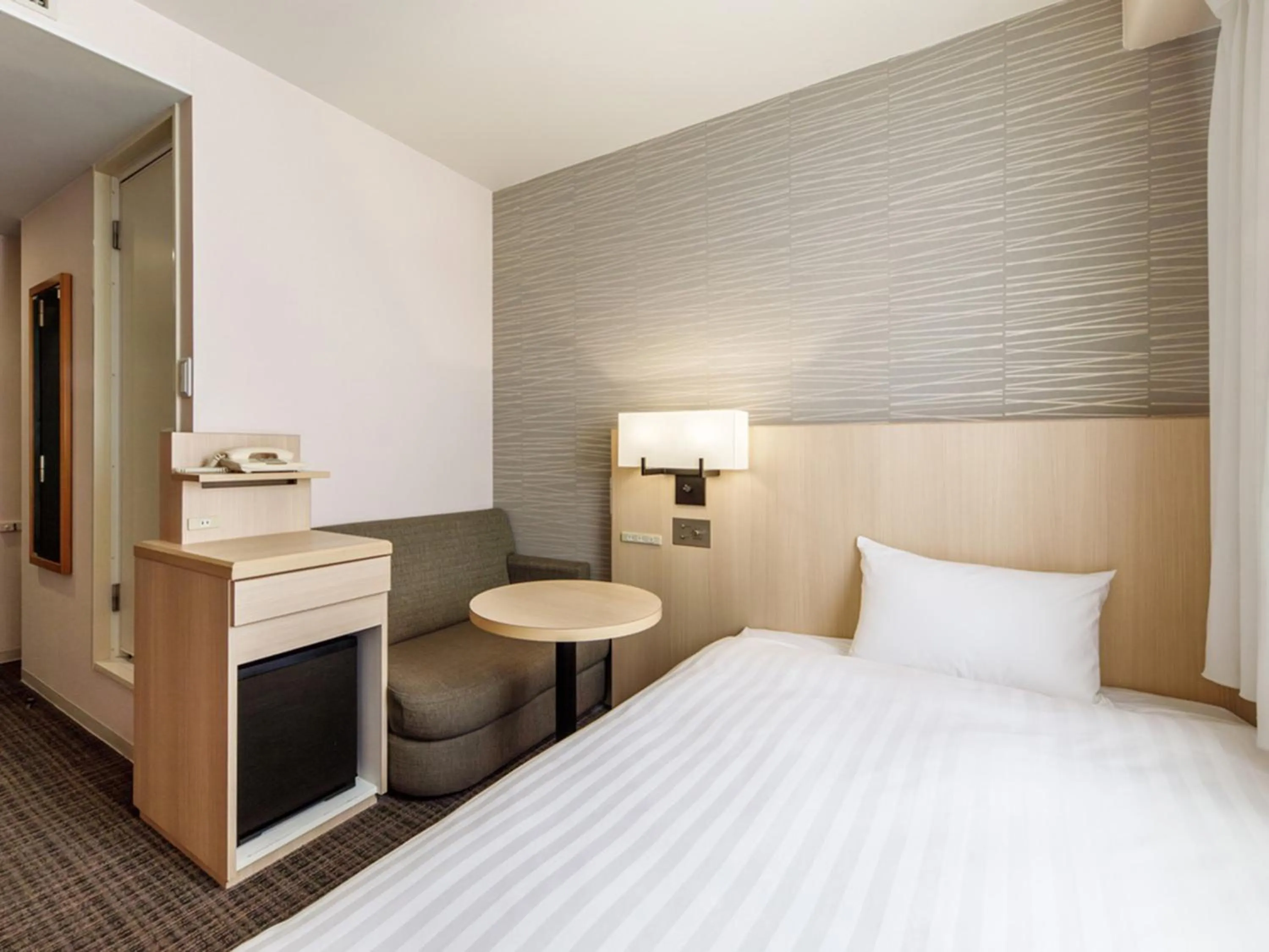 Photo of the whole room, Bed in Nishitetsu Resort Inn Beppu