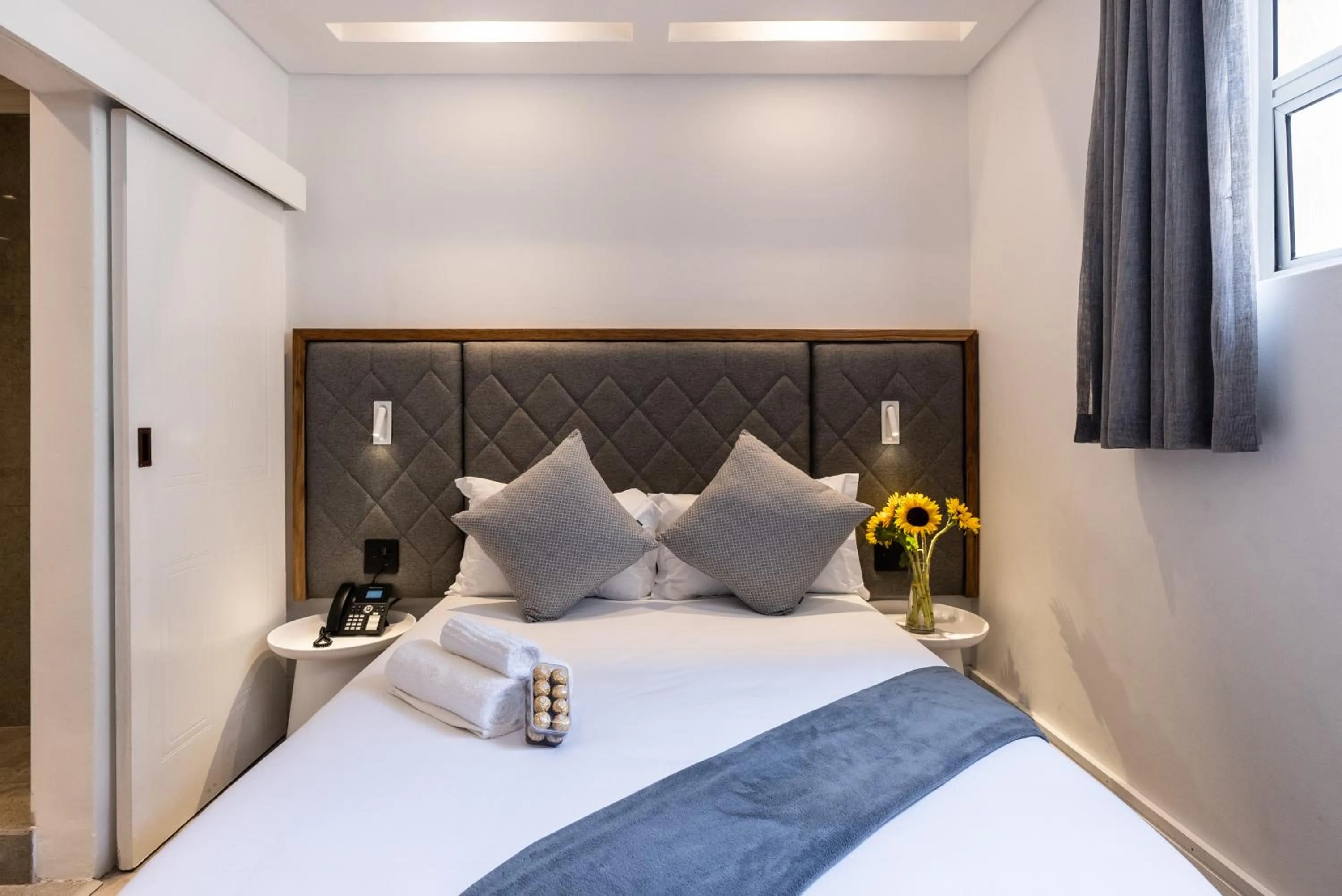 Bed in Cape Diamond Boutique Hotel