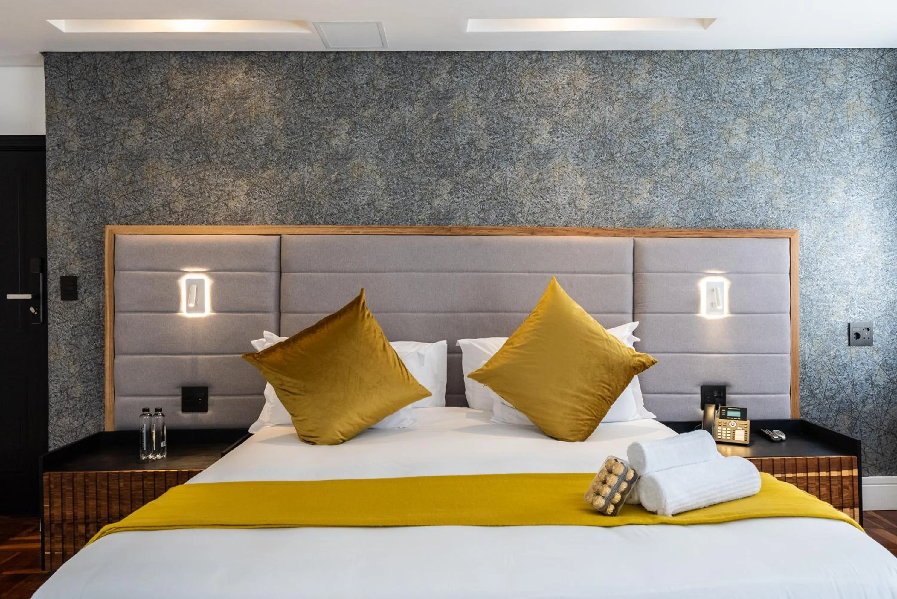 Bed in Cape Diamond Boutique Hotel