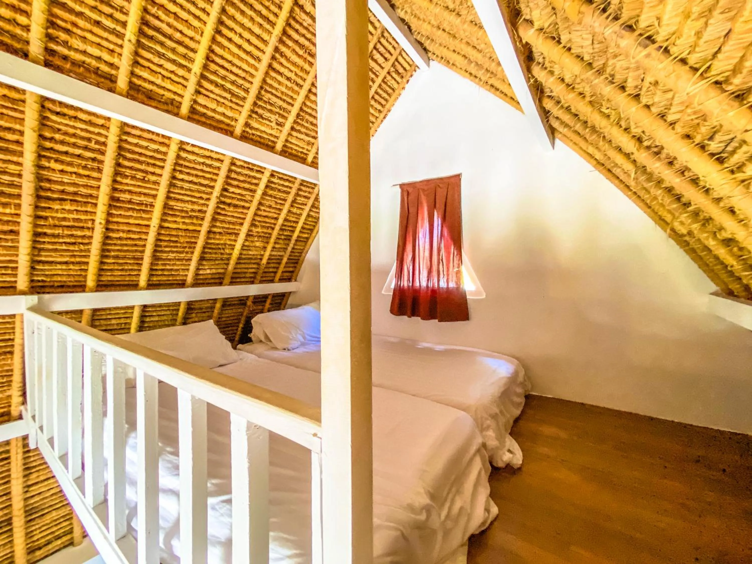 Bed in Namaste Bungalows Resort