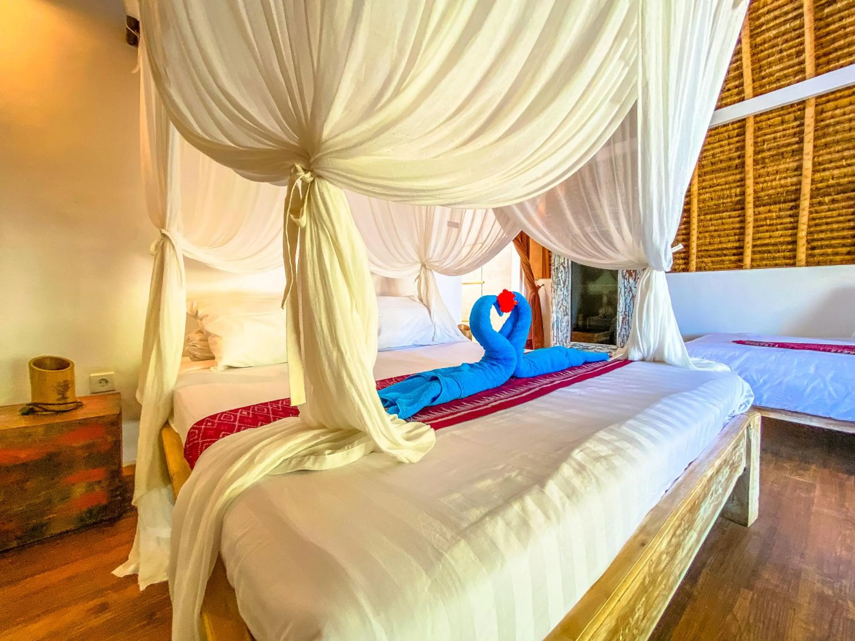 Bed in Namaste Bungalows Resort