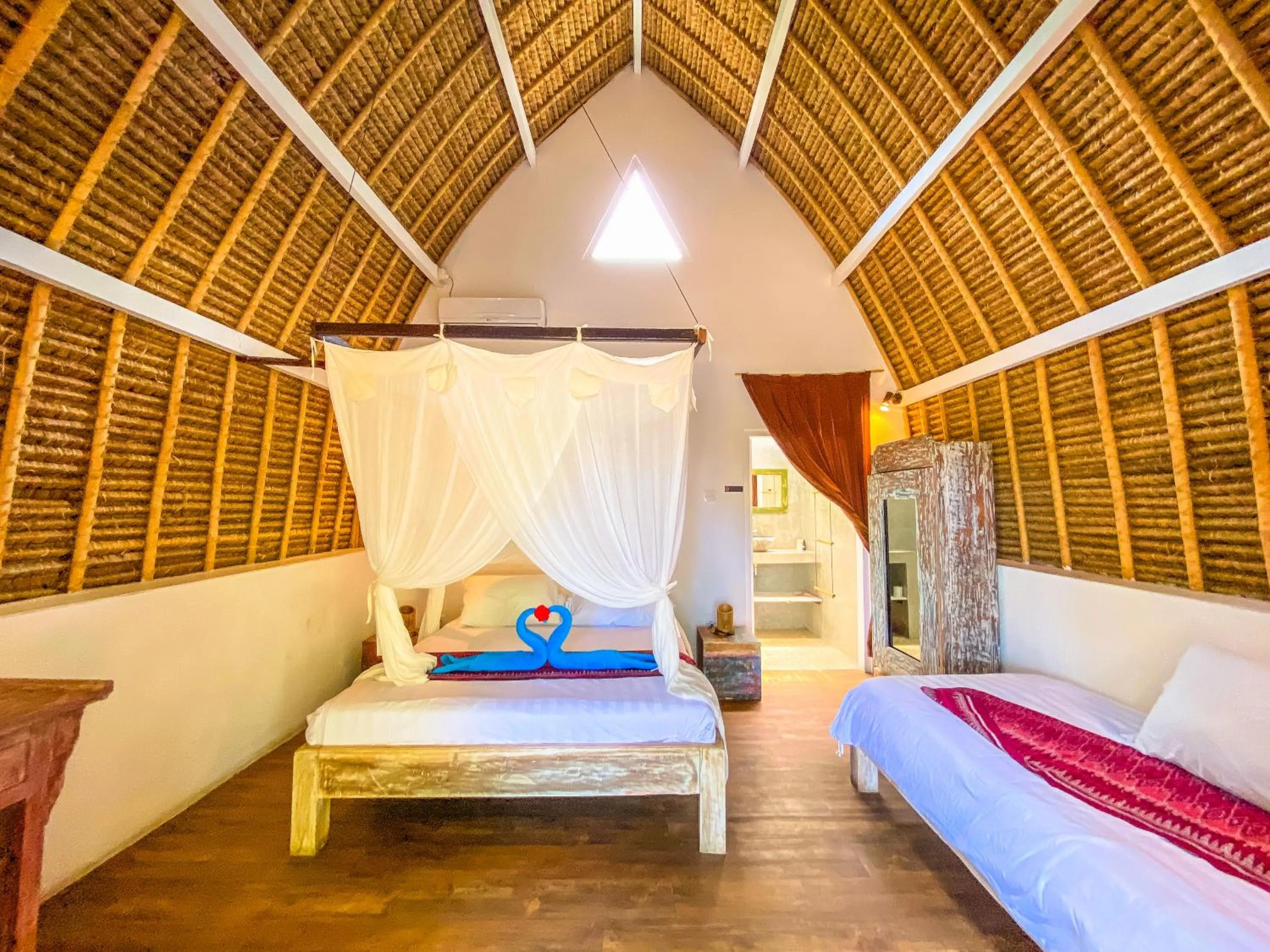 Bed in Namaste Bungalows Resort