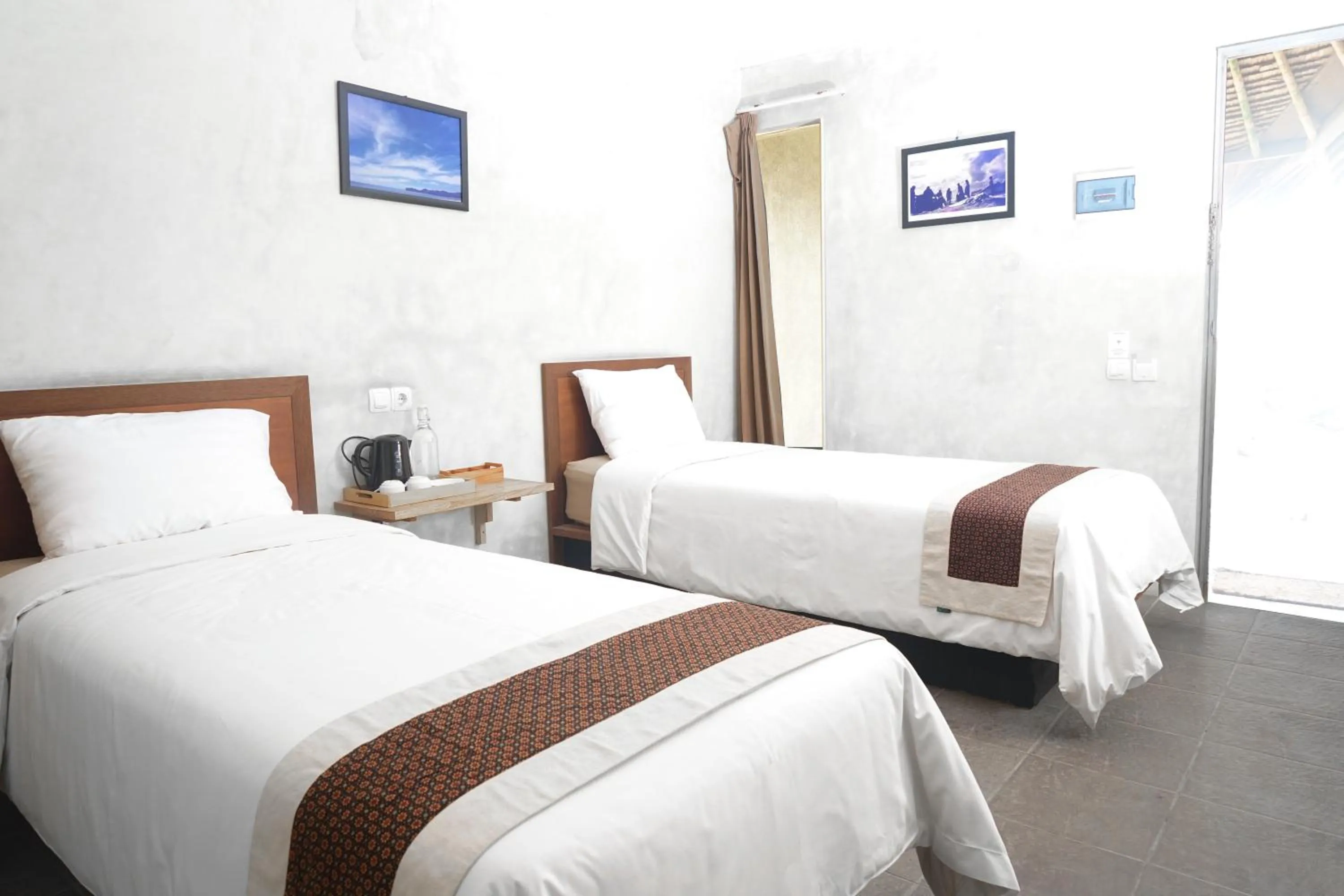 Bed in Bale Karang Cottages