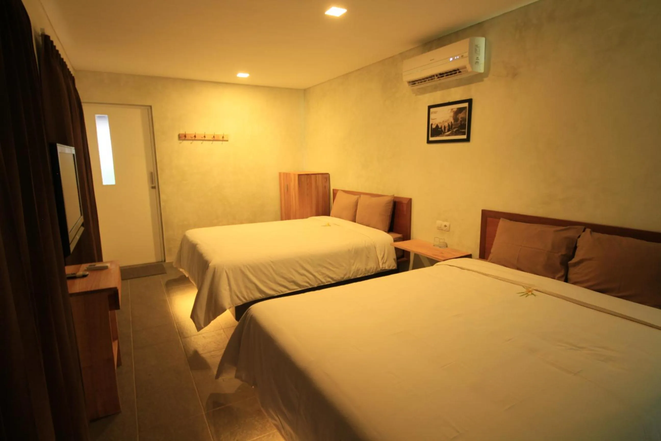 Bed in Bale Karang Cottages