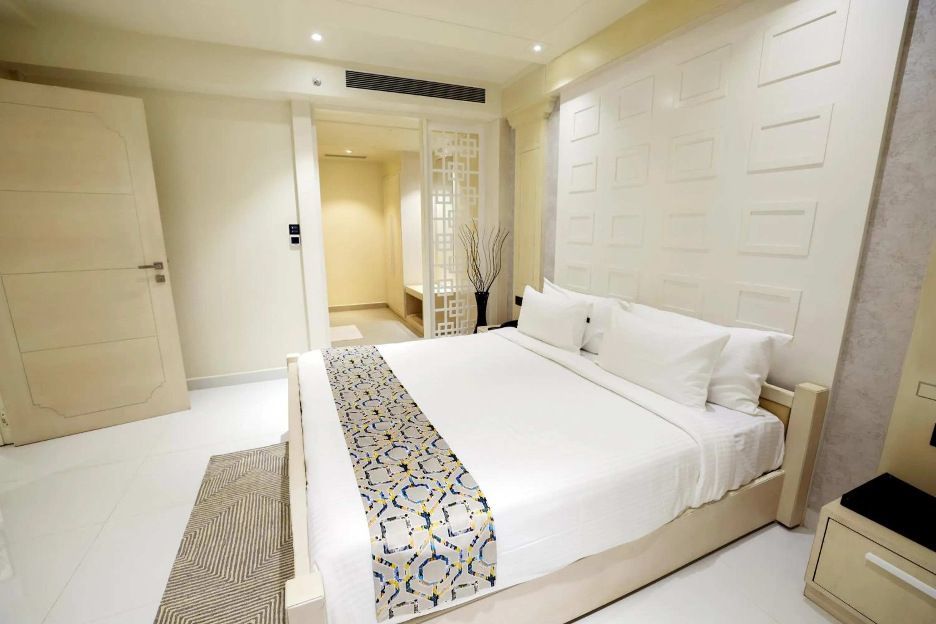 Bed in AJ Grand Hotel