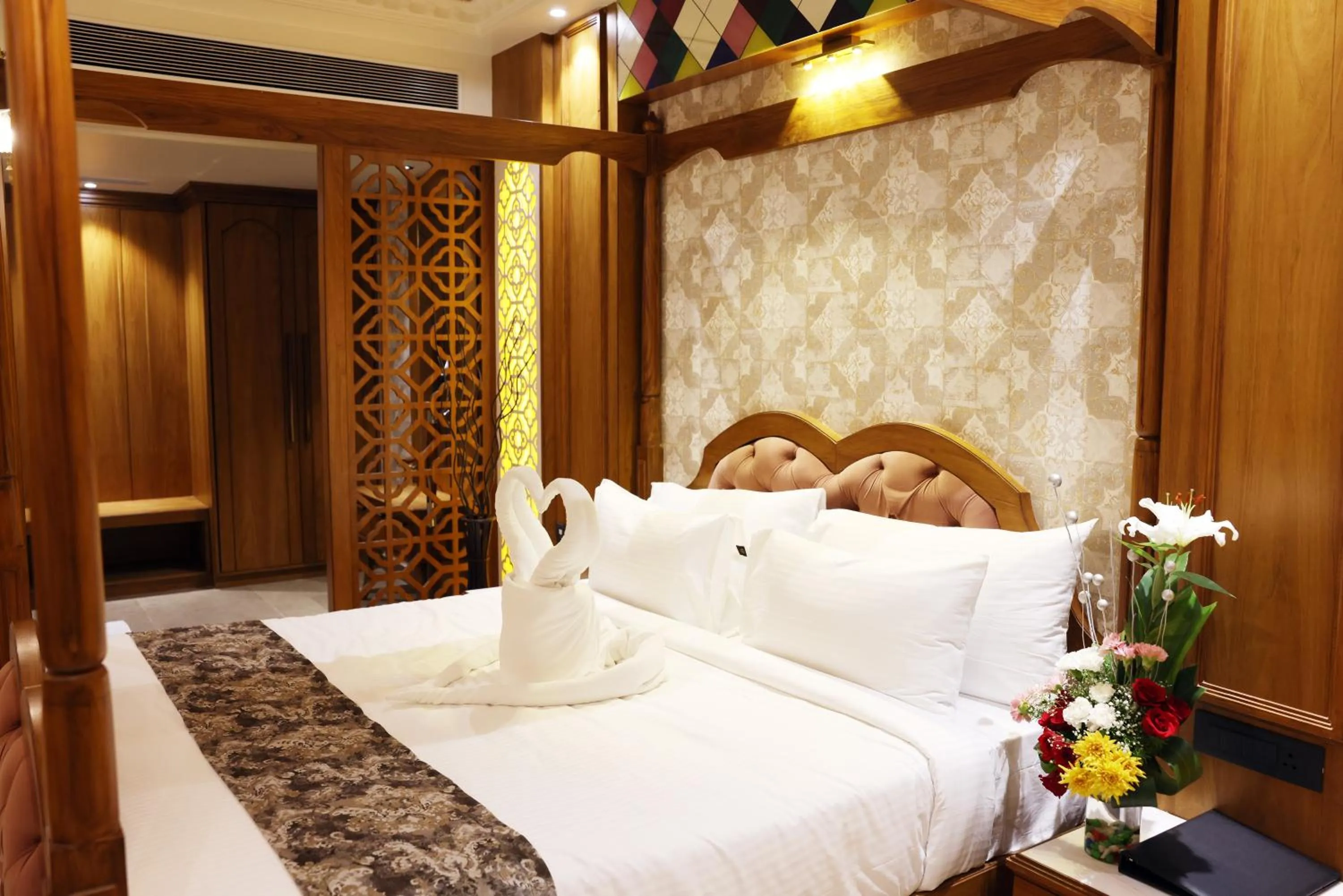 Bed in AJ Grand Hotel