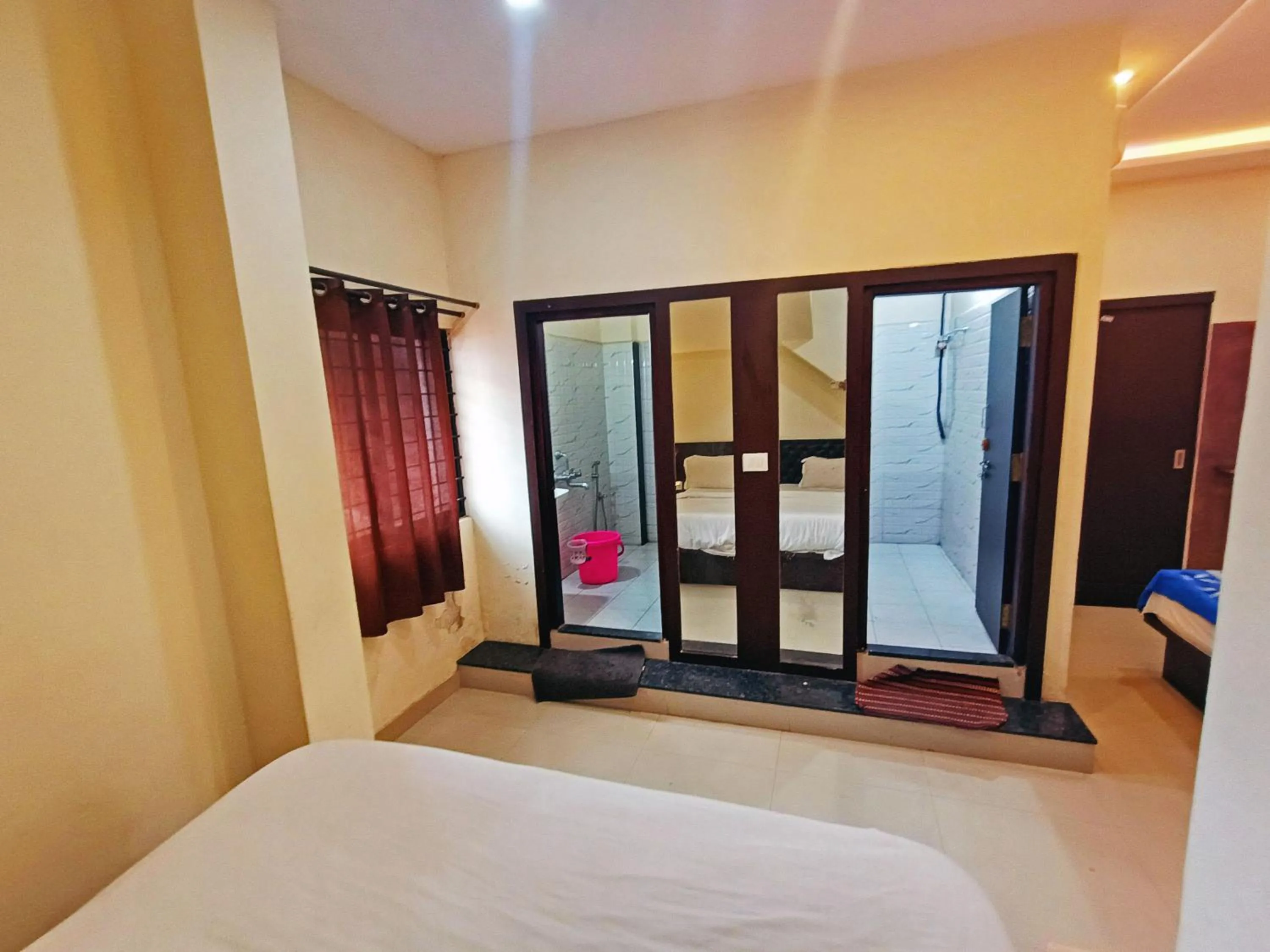 Bathroom, Bed in MG Residency