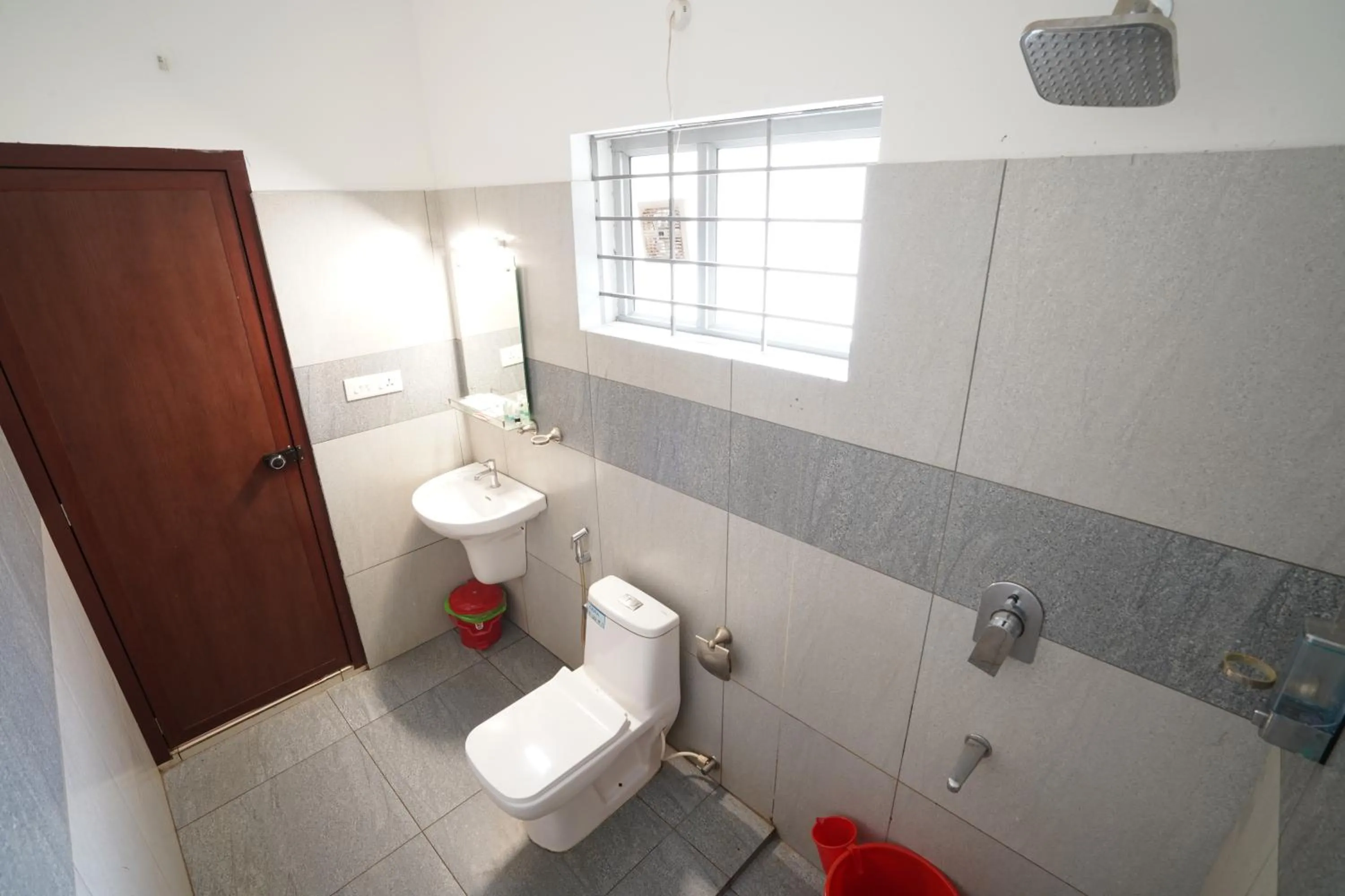 Shower in Atmos Inn Calicut Near Aster Mims Hospital