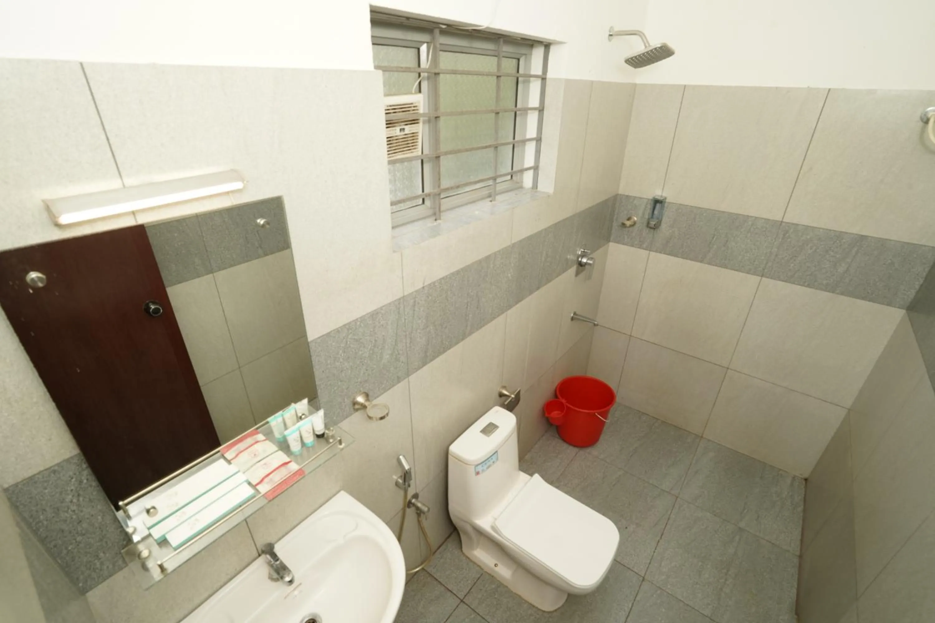 Shower in Atmos Inn Calicut Near Aster Mims Hospital