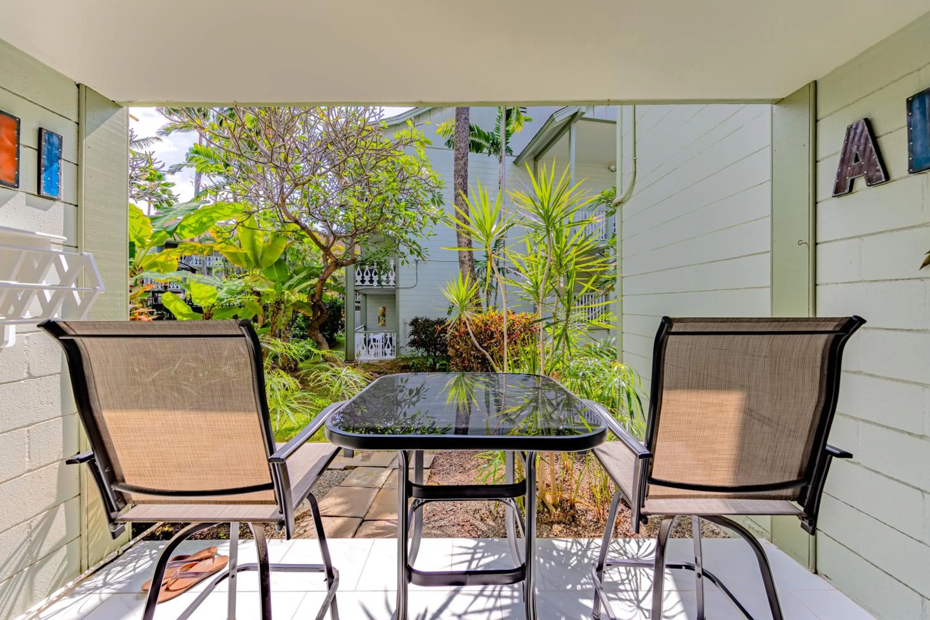Patio in DOWNTOWN Hawaiian Theme Condo with Hot Tub, Pool & Beach - Kona Islander Inn