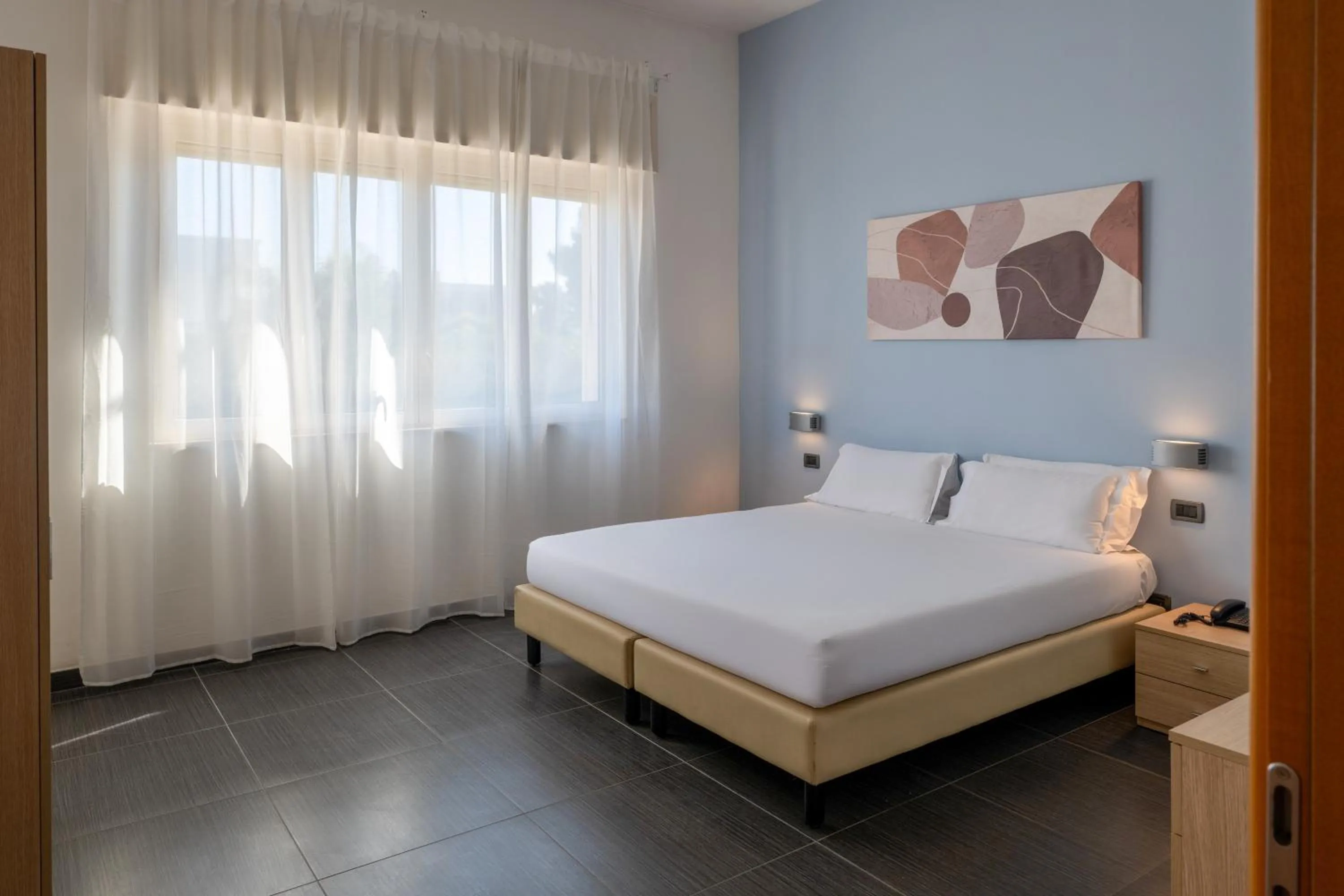 Bed in Hotel Riva Del Sole