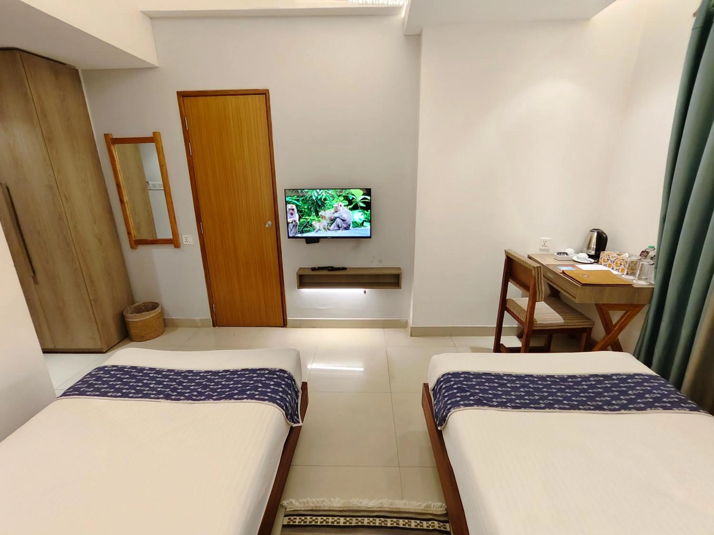 Communal lounge/ TV room, Bed in Hotel Nandini