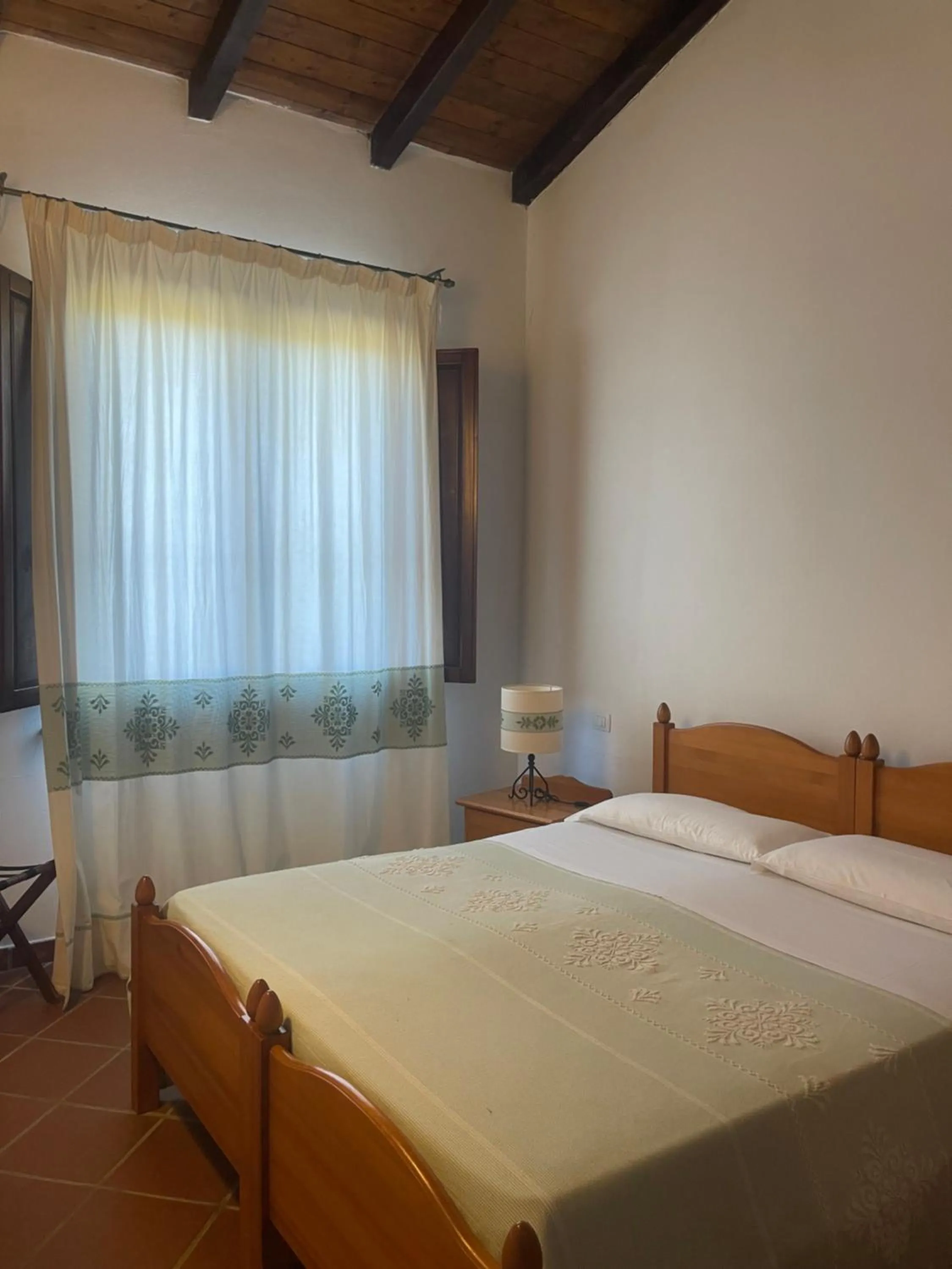 Bed in Hotel Su Nuraxi