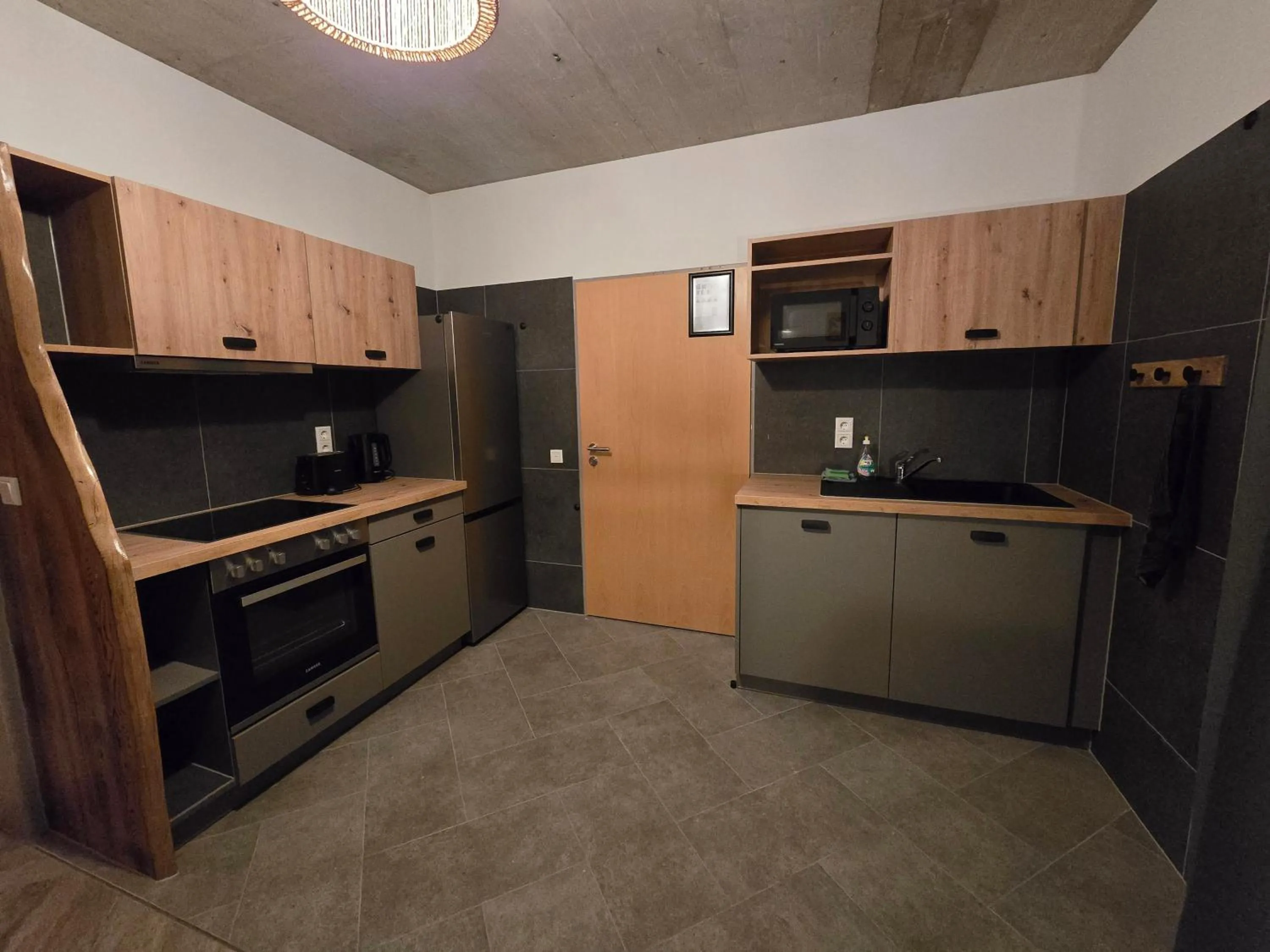 Kitchen or kitchenette in Aparthotel Fairschlafen Minden