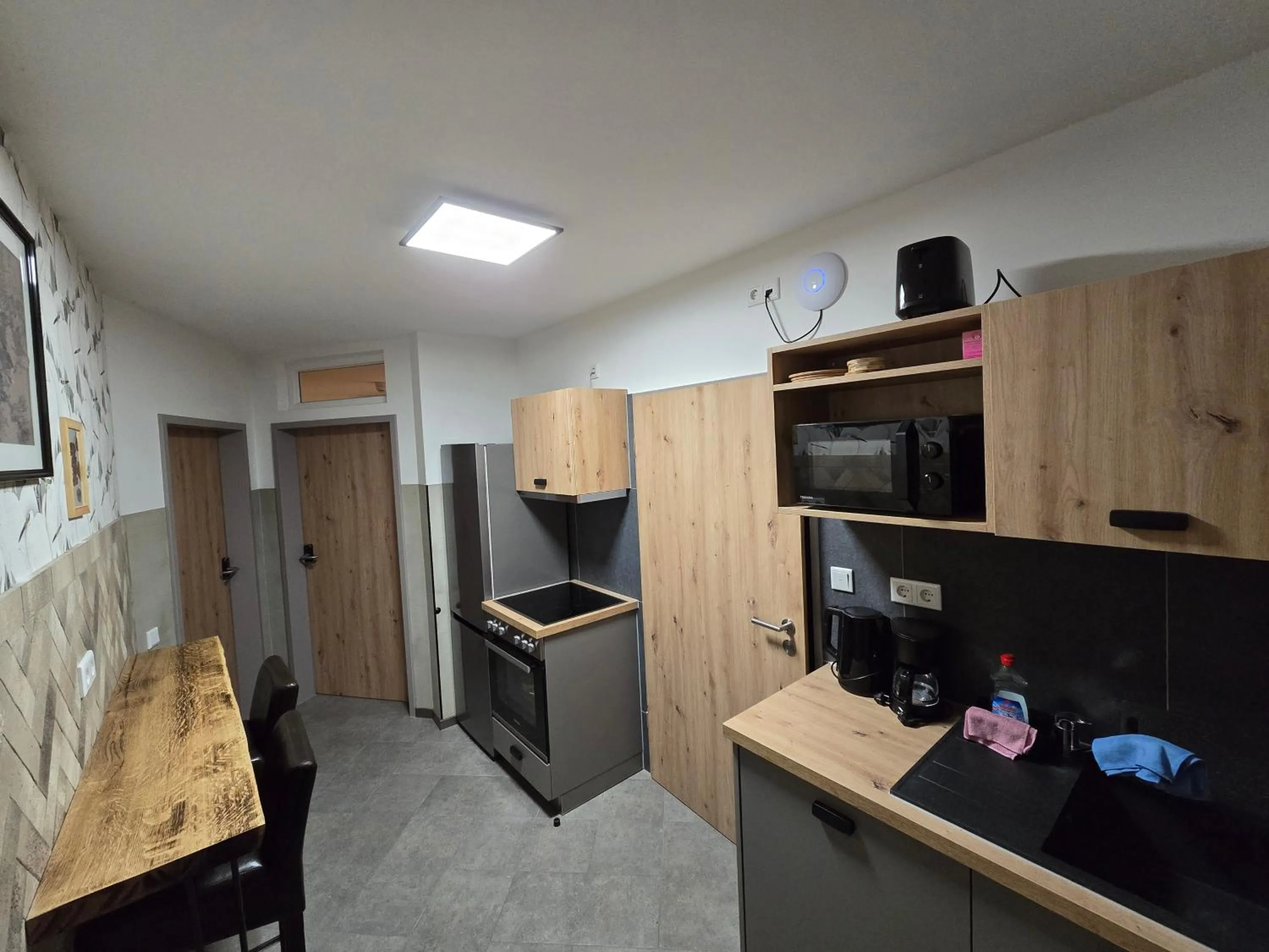 Kitchen or kitchenette in Aparthotel Fairschlafen Minden