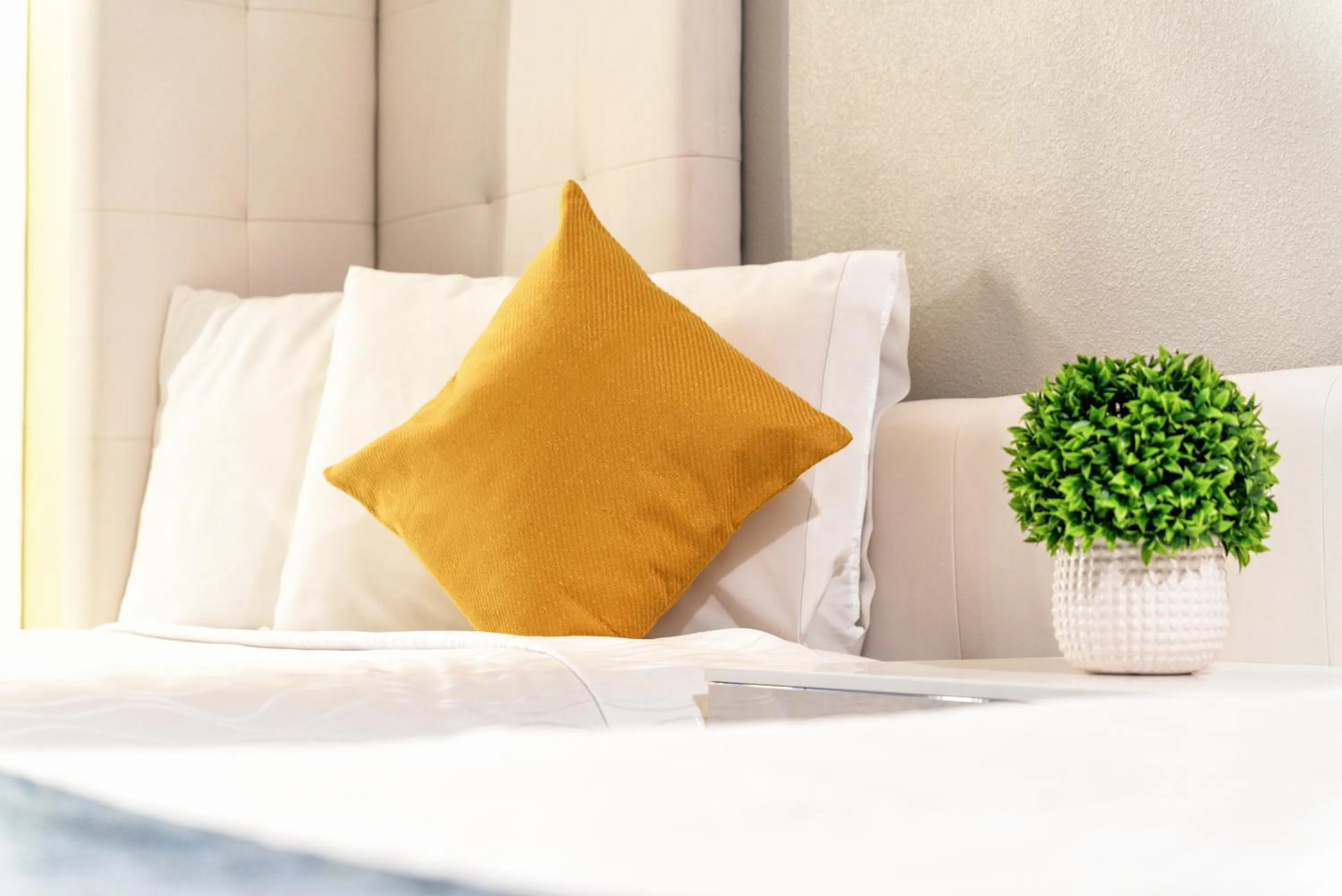 Bed in Aspire Inn Studios & Spas