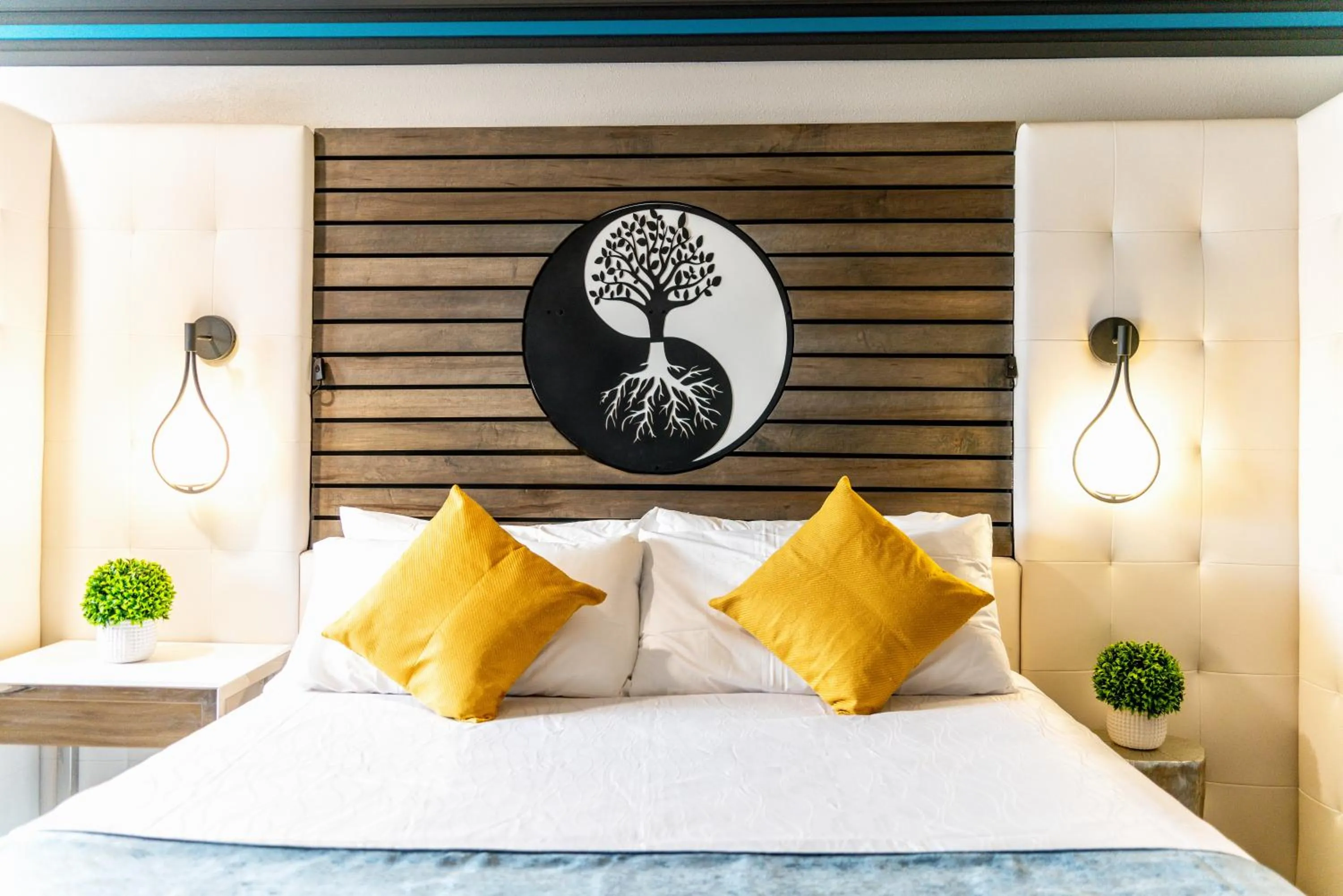 Bed in Aspire Inn Studios & Spas