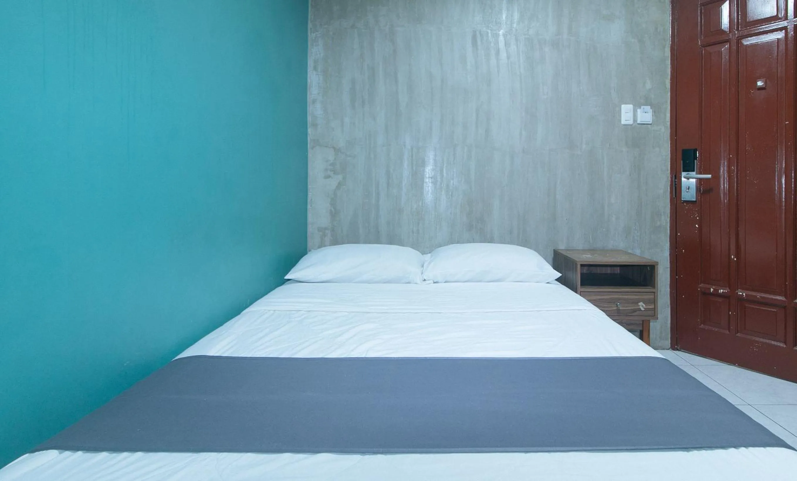 Bed in Rcee Place by RedDoorz