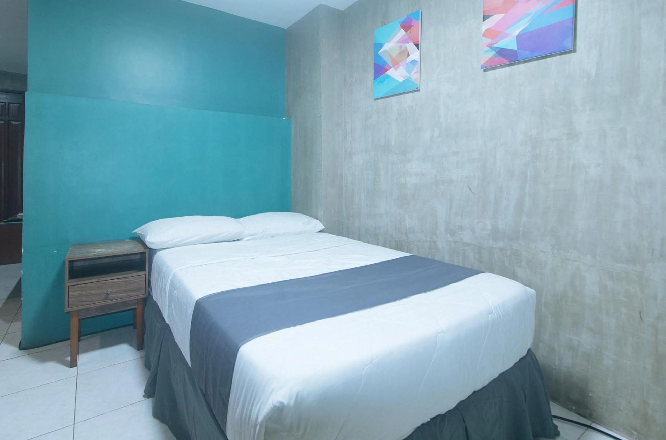 Bed in Rcee Place by RedDoorz