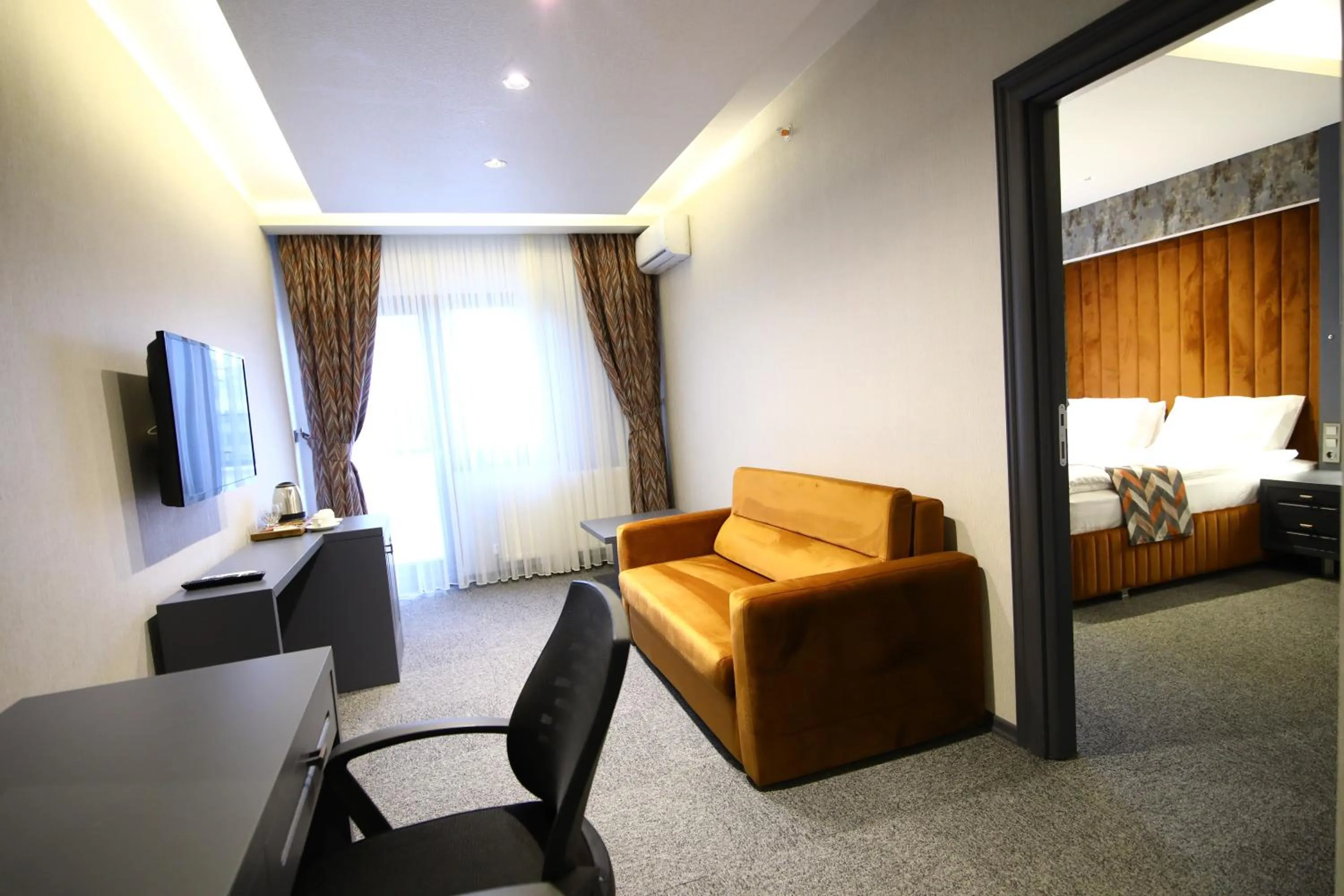 Bed in GRAND DORA HOTEL