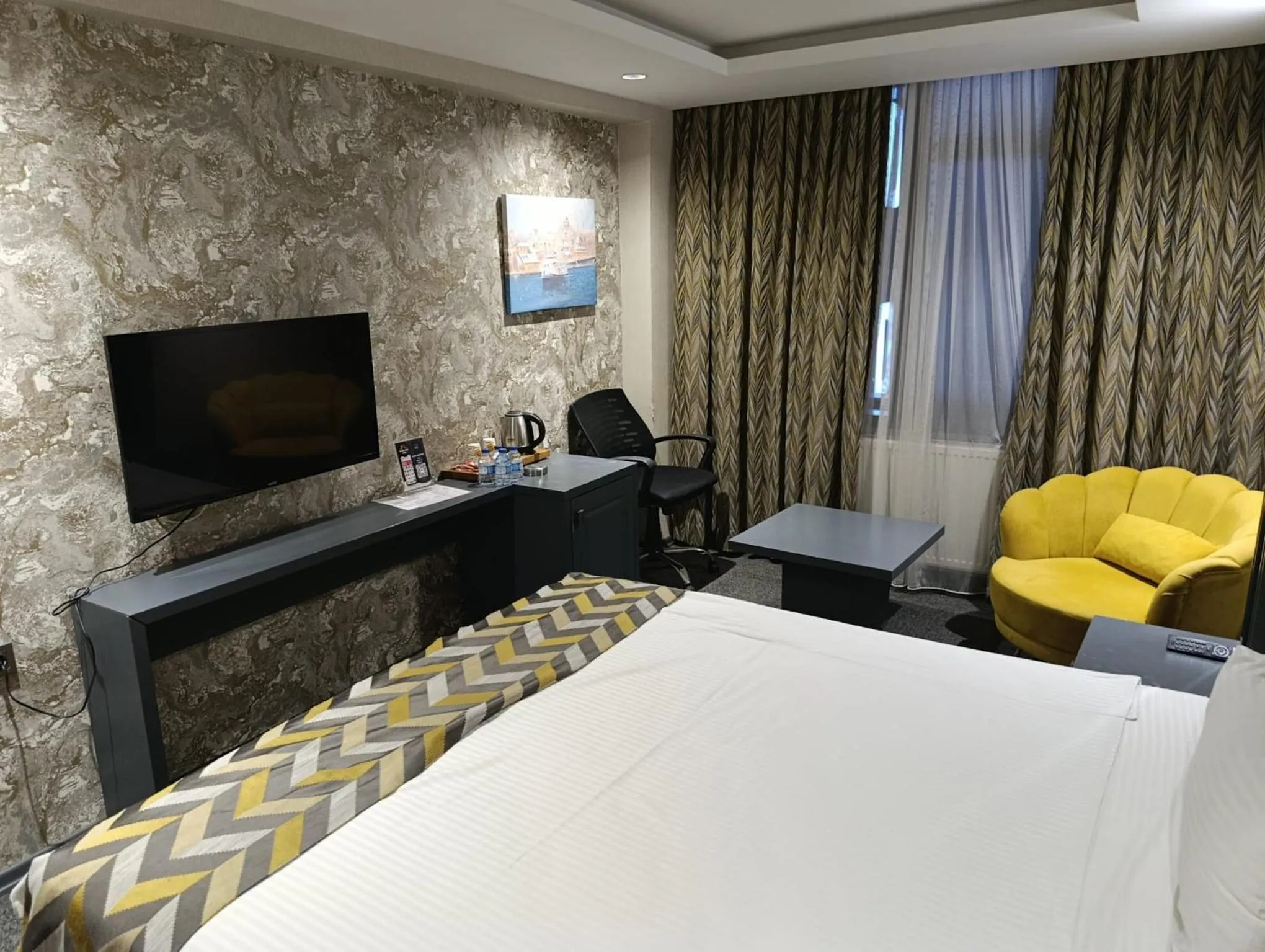 Bed in GRAND DORA HOTEL