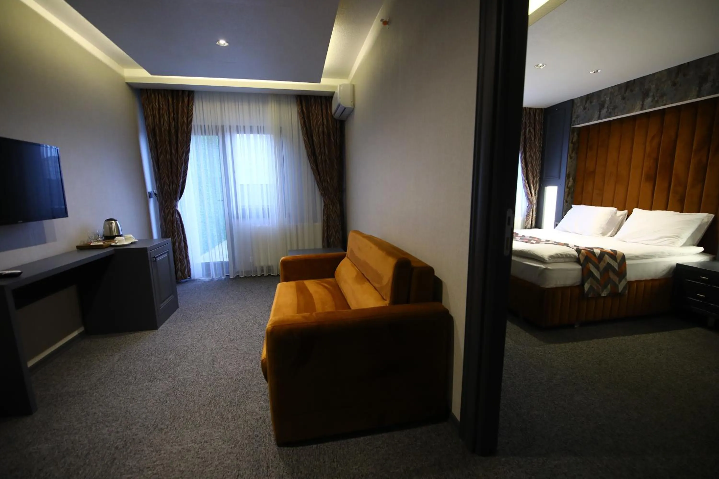 Seating area, Bed in GRAND DORA HOTEL