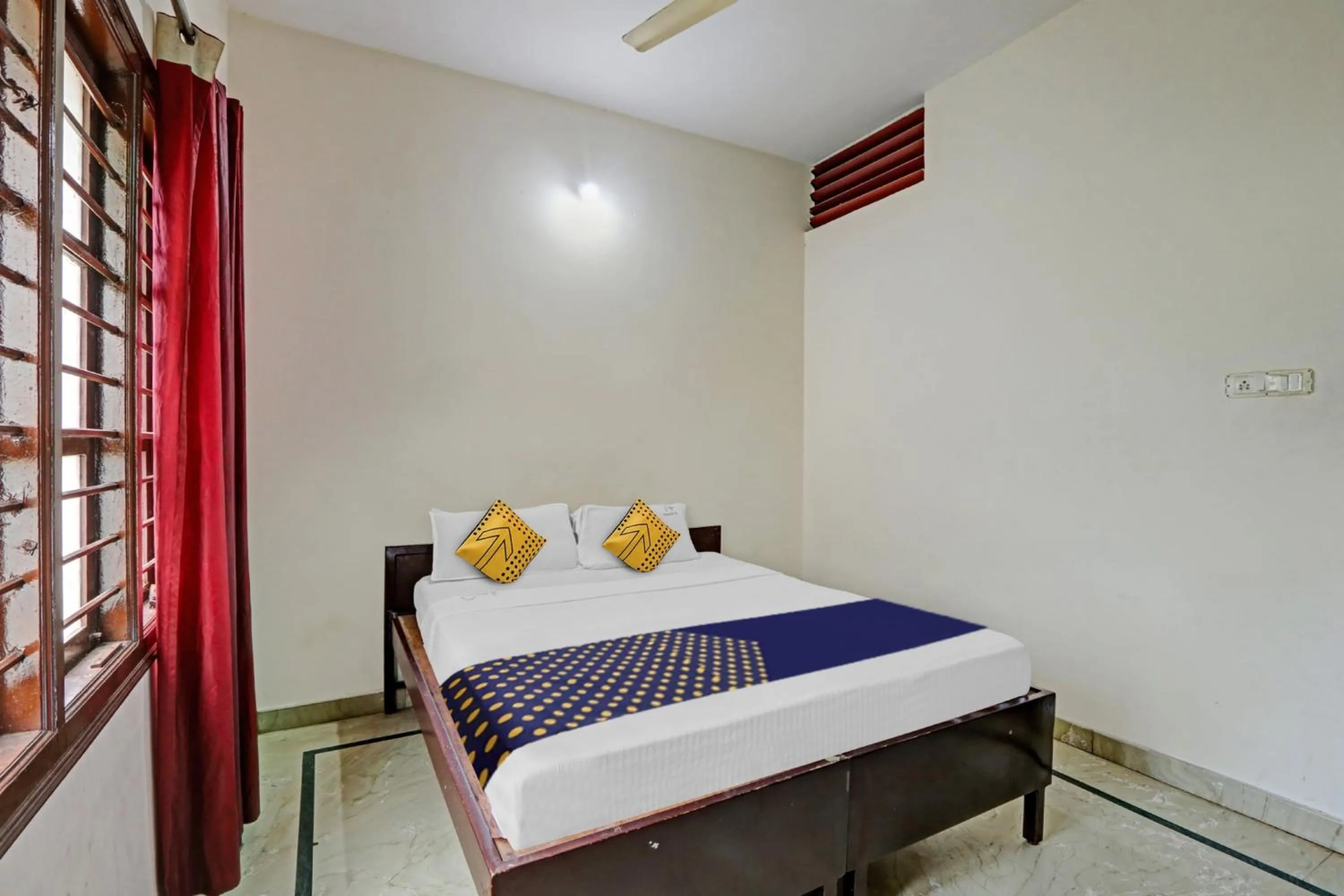 Bedroom in Hotel O Vishu Moni Residency