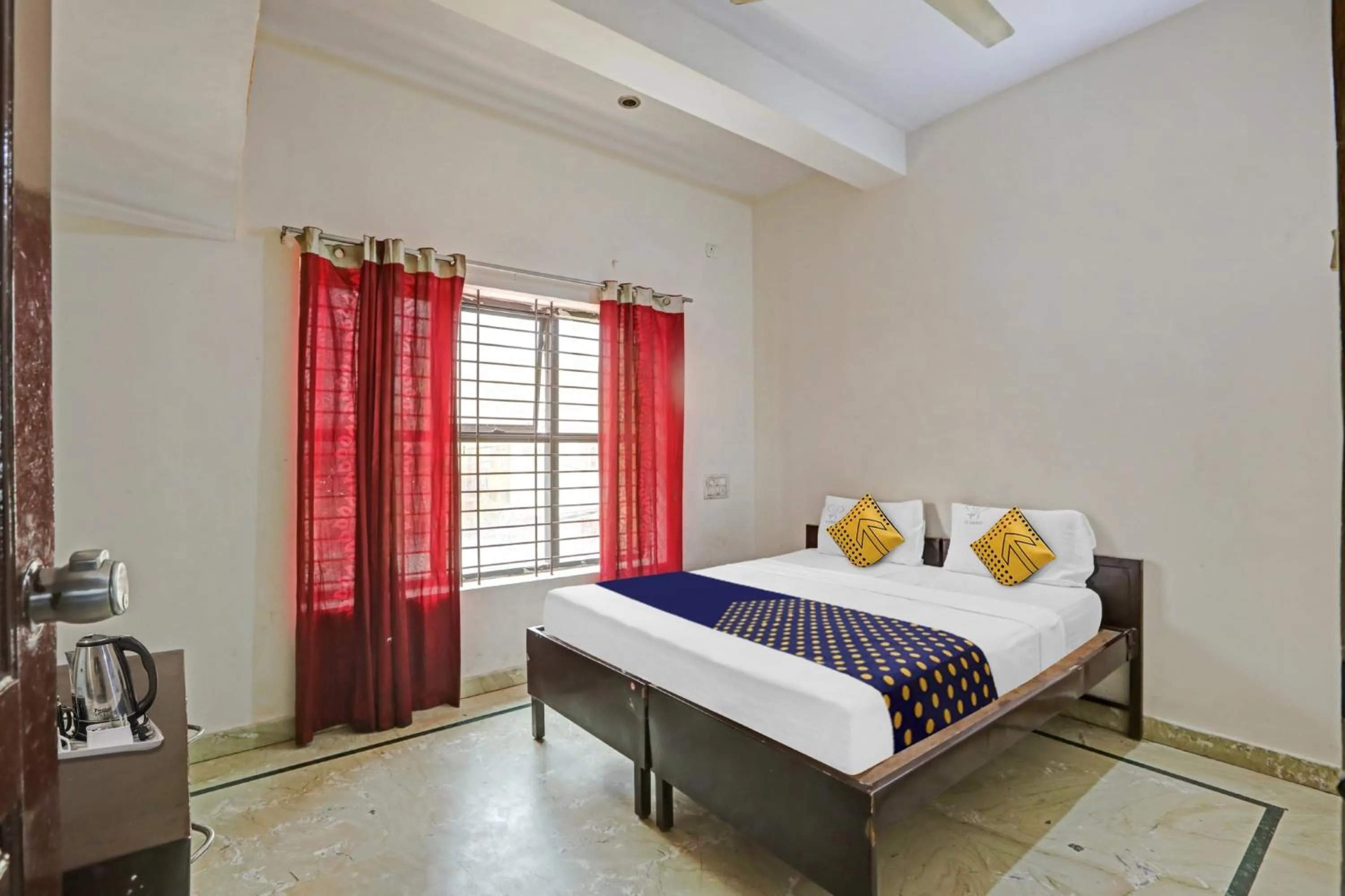 Bedroom in Hotel O Vishu Moni Residency