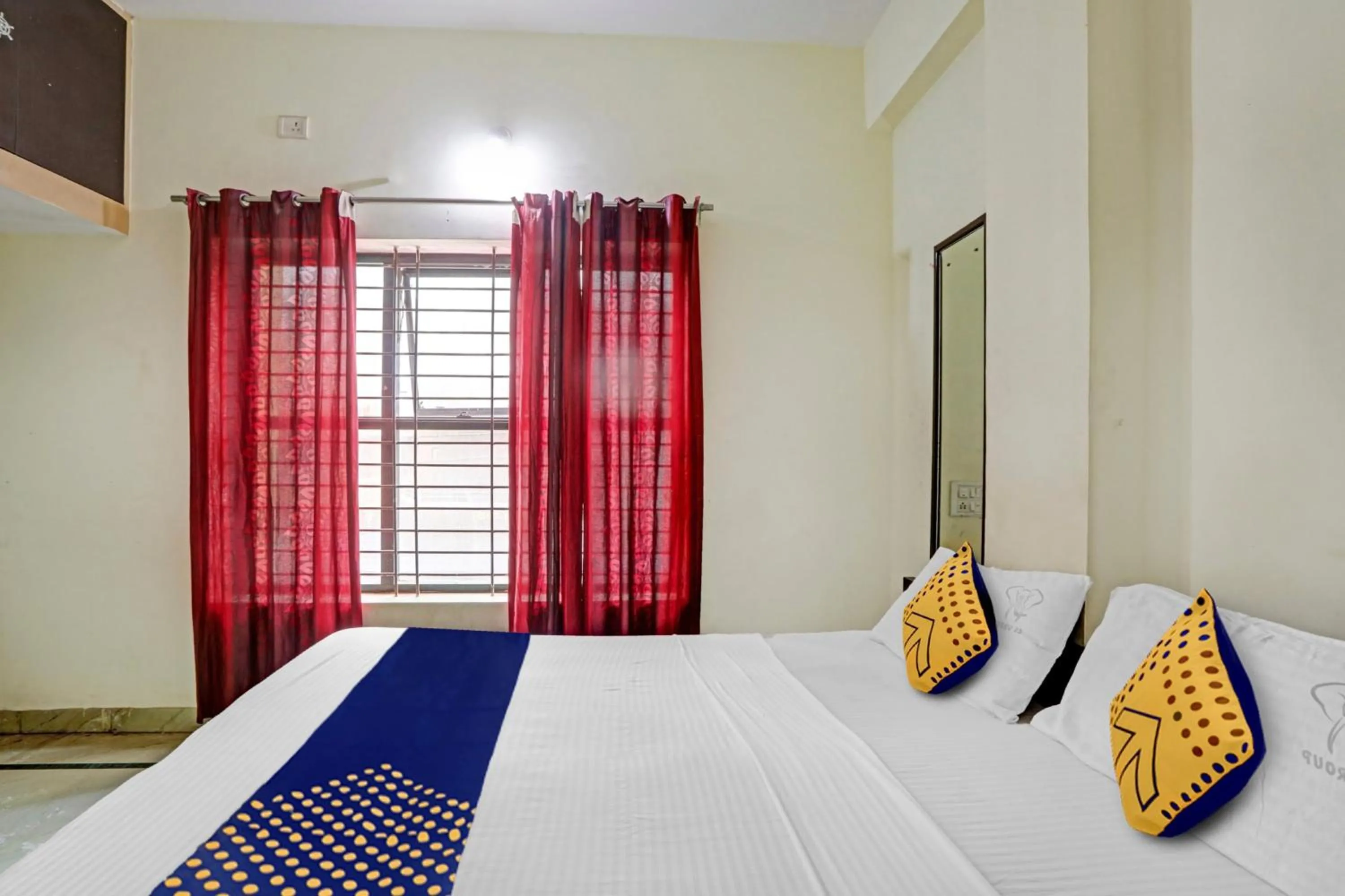Bedroom in Hotel O Vishu Moni Residency