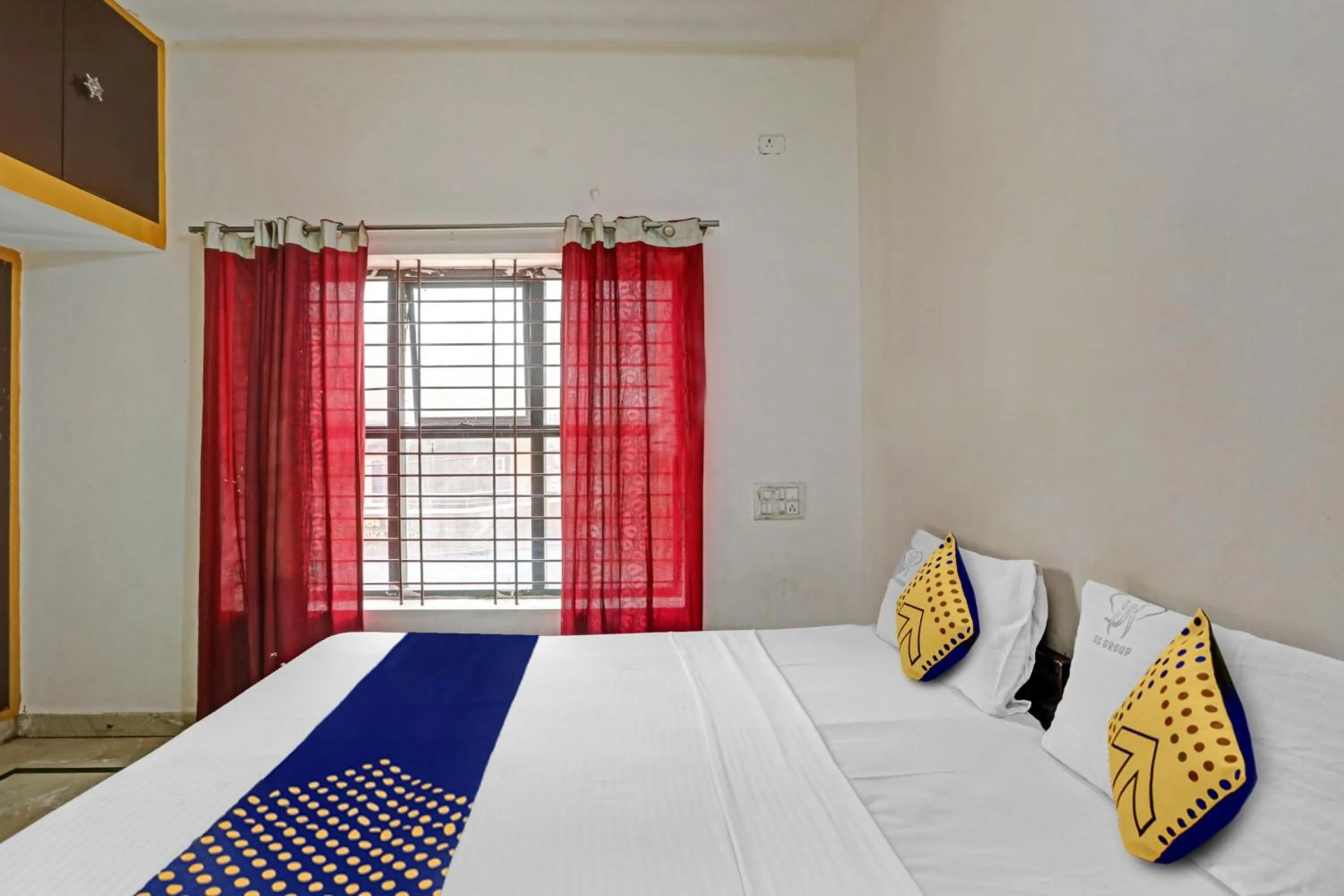 Bedroom in Hotel O Vishu Moni Residency