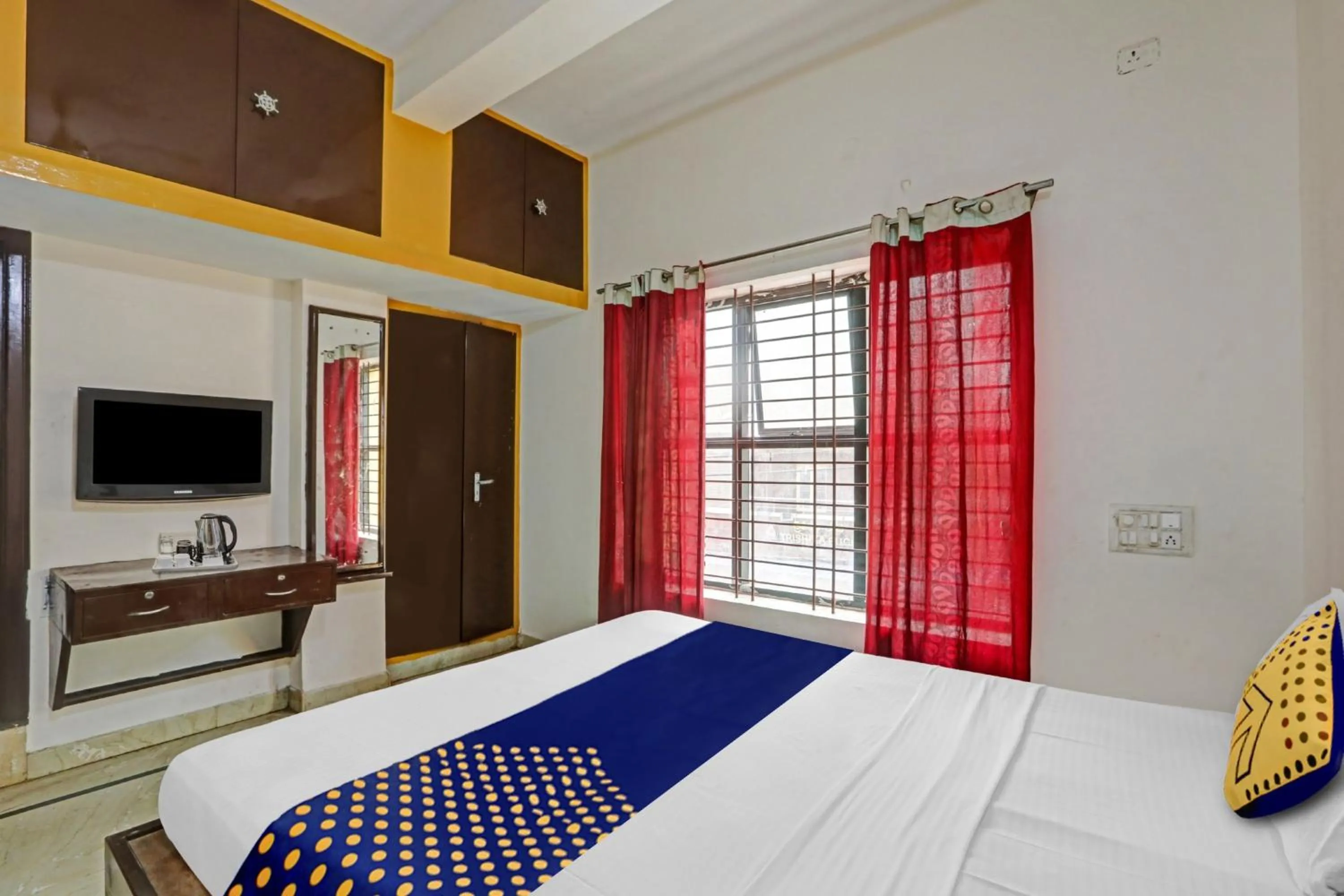 Bedroom in Hotel O Vishu Moni Residency