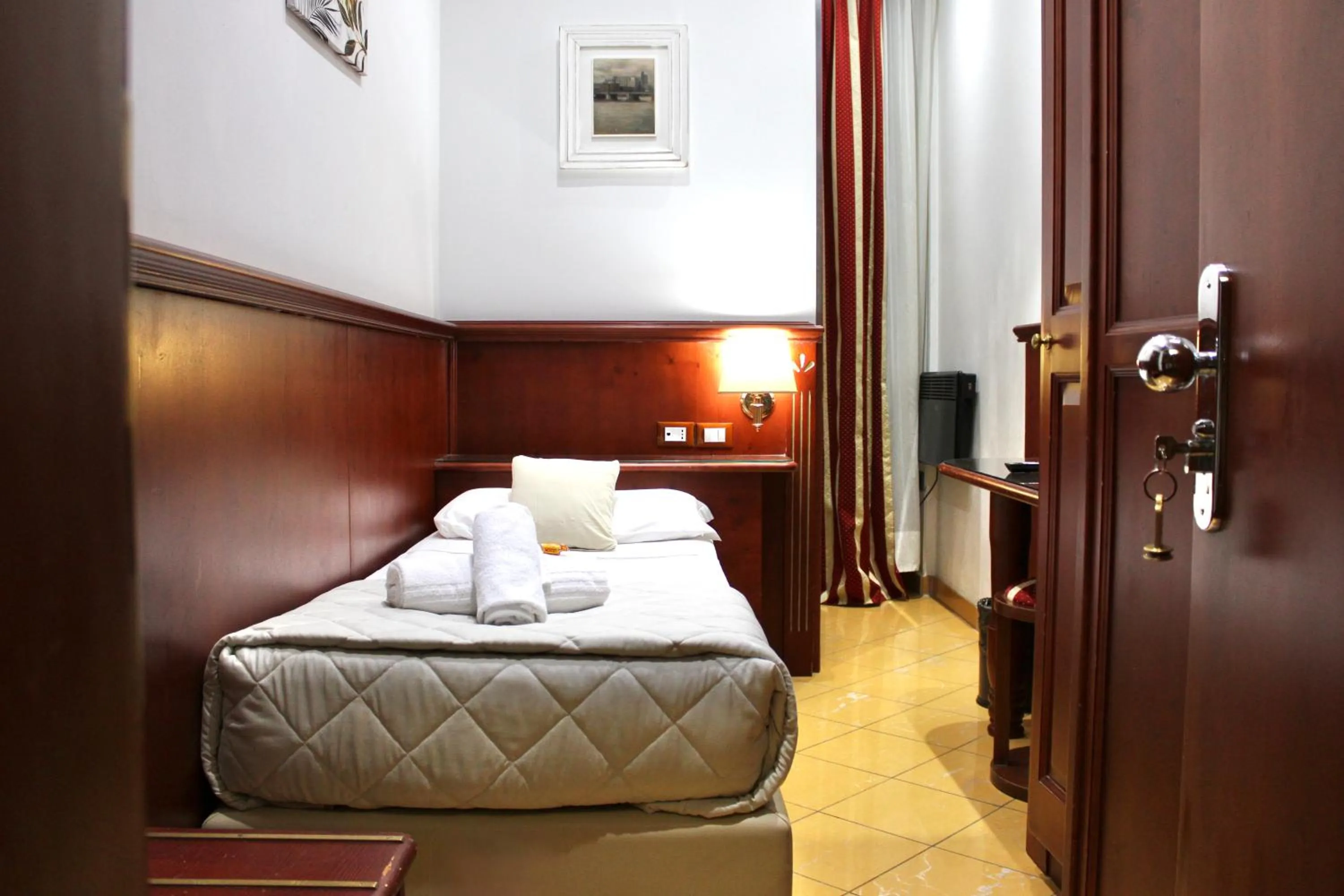 Photo of the whole room, Bed in Hotel Fiorella Milano