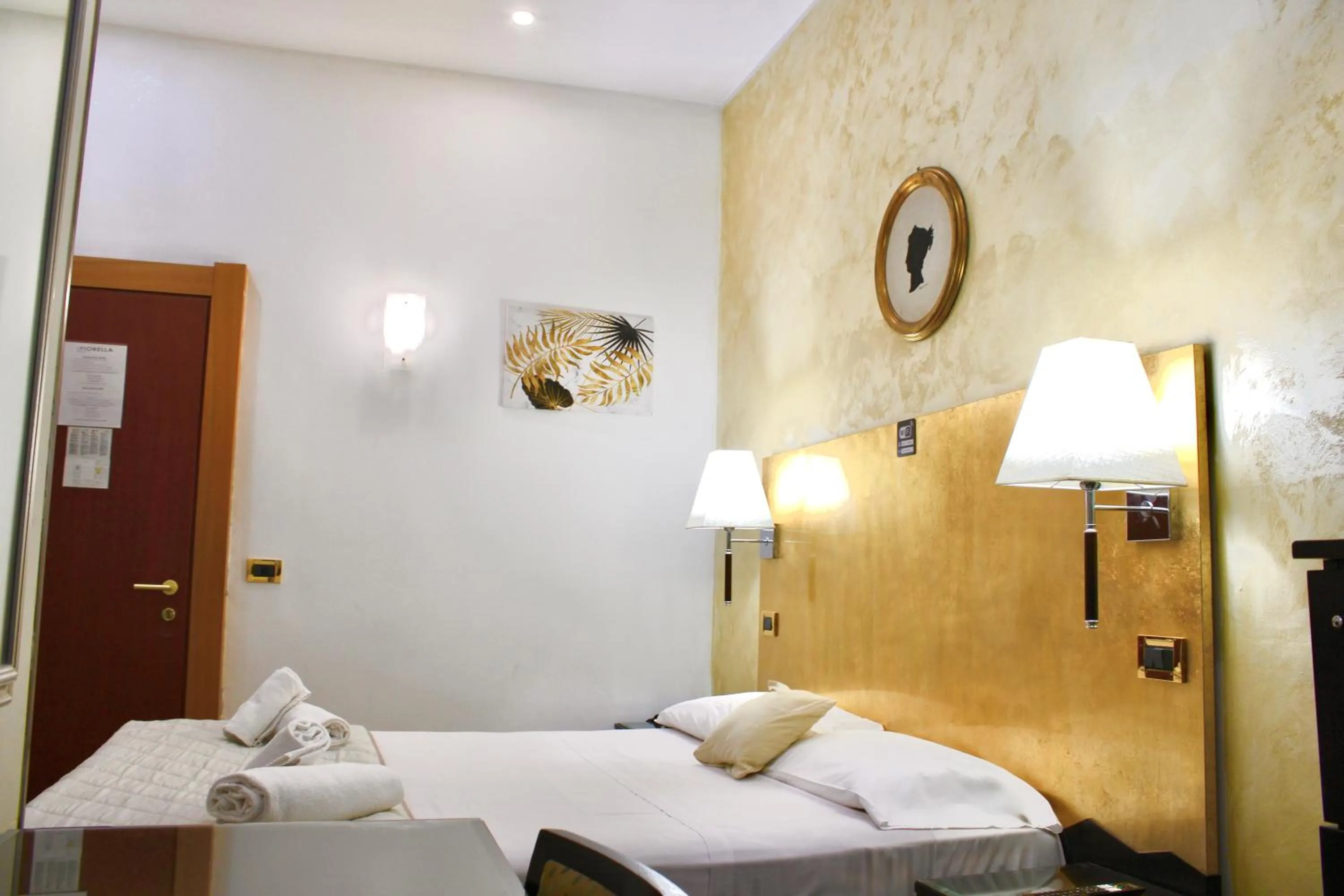 Photo of the whole room, Bed in Hotel Fiorella Milano